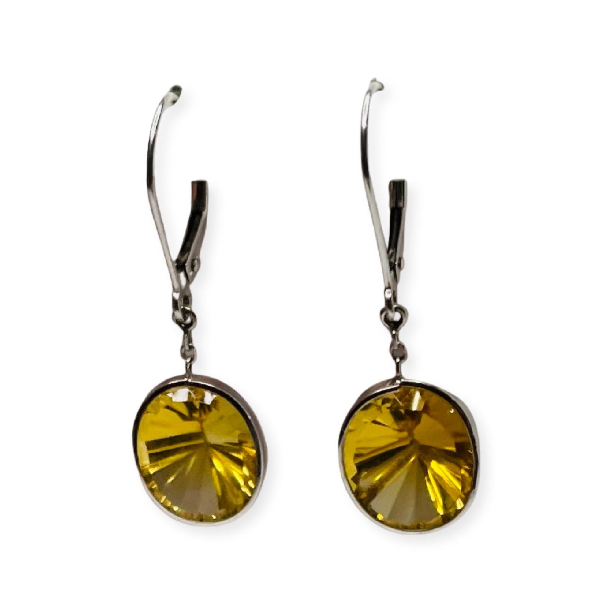 Lithos 14K white Gold Citrine Earrings. There are 12 carats of citrine bezel set in 14K white gold  They have french wires. They measure 10.0 mm x 14.0 mm. 400-70-841
