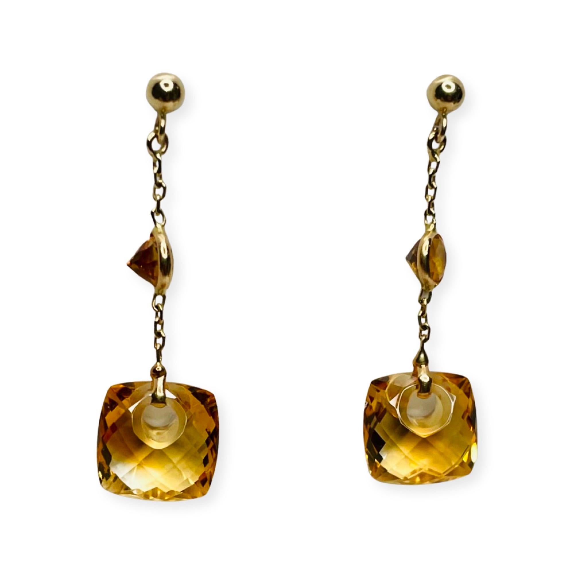Lithos 14K Yellow Gold Citrine Earrings. There is a total citrine weight of 6.5 carats. The earrings are 31.42 mm long. They have gold balls with posts.  There is a bezel set citrine in the center of the chain.  The bottom citrine is laser drilled