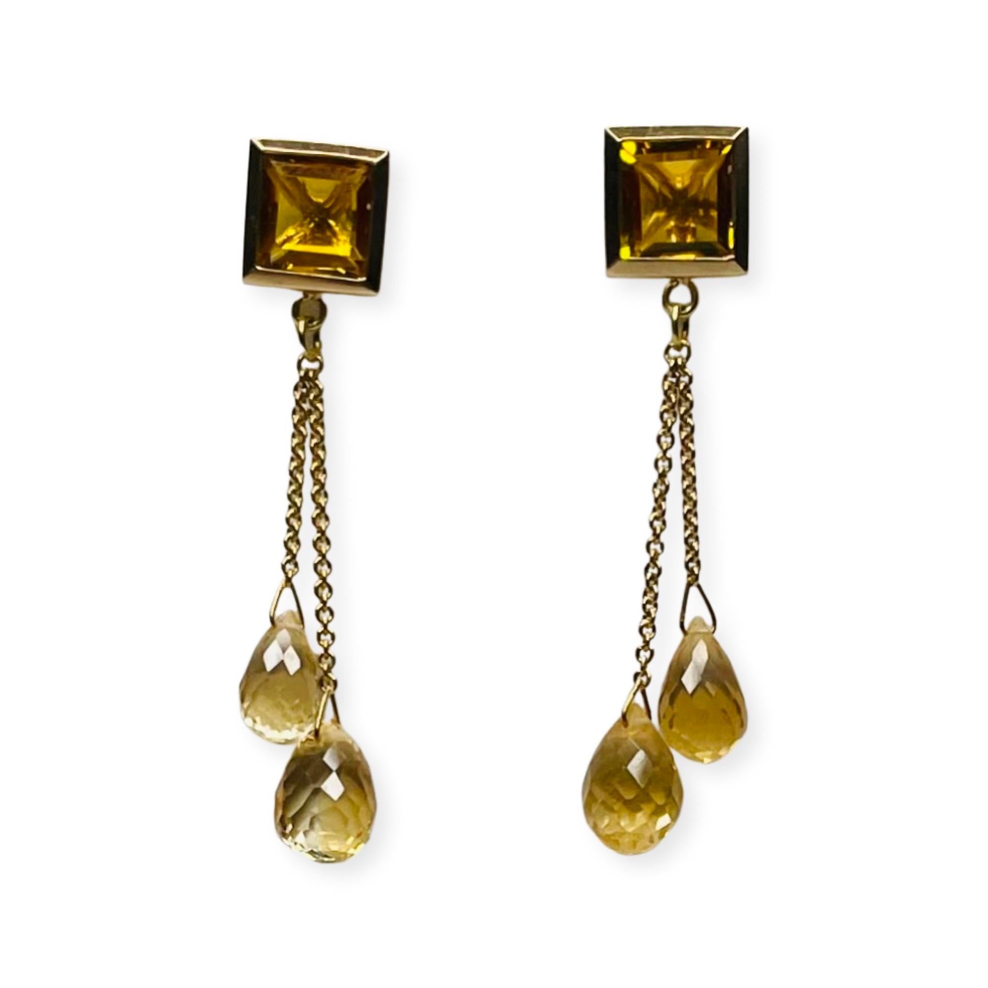 Lithos 14K  and 18K Yellow Gold Citrine Earrings. There are 2 - 8.5 mm square citrines, bezel set in 14K yellow gold. They have posts and 14KY gold backs imbedded in silicon. From these citrines dangle 2 citrine briolettes off of a ring.  They are