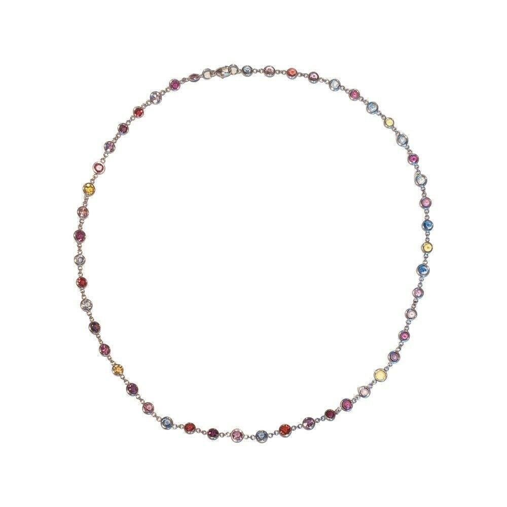 Lithos 18K White Gold Multi Colored Sapphire Necklace. There are 48 natural Sapphires for a total sapphire weight of 20.64 carats. The sapphires are set in cinch wraps.  It is 18 inches long with a lobster closure.   
500-50-847