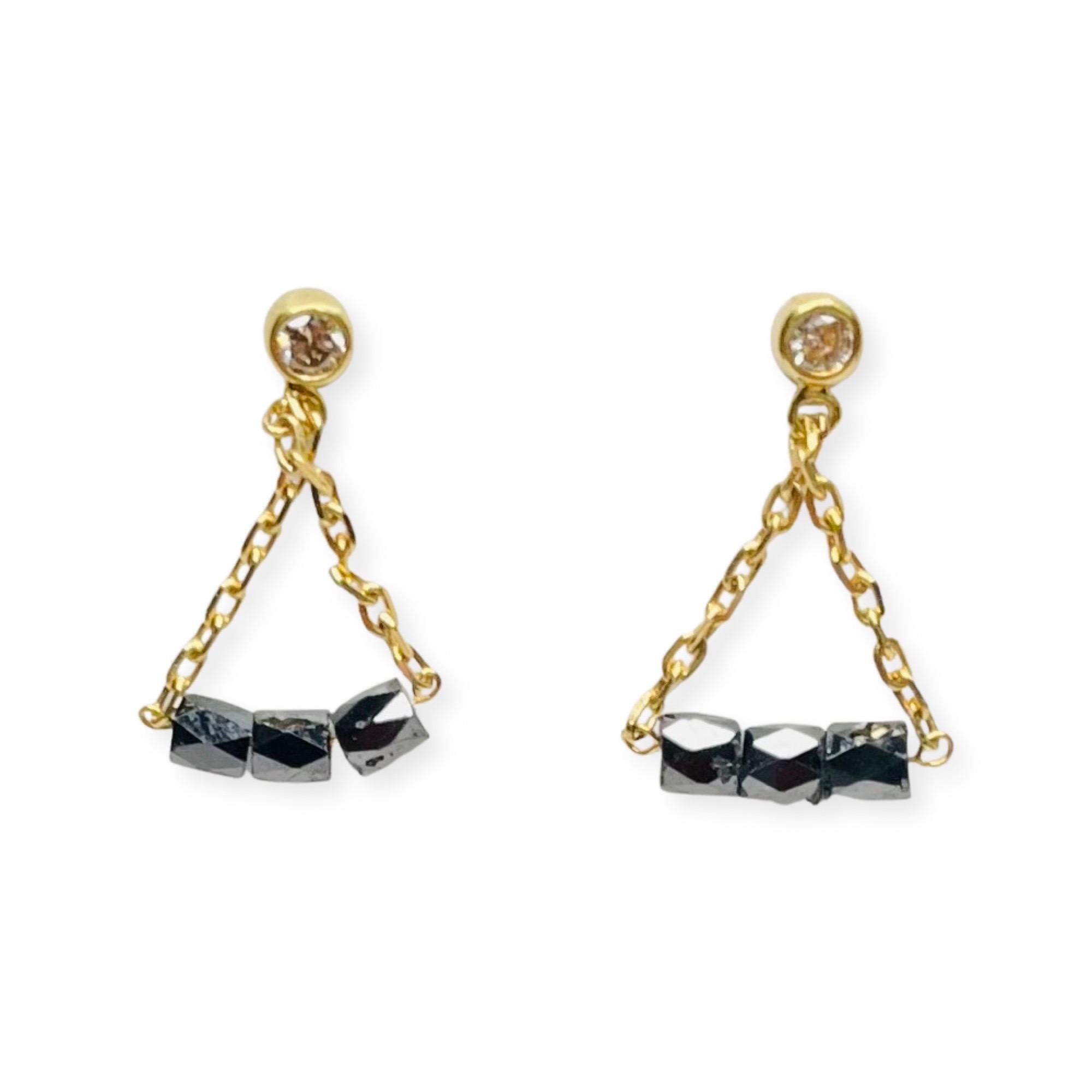 Lithos 18K Yellow Gold Black Diamond Faceted Barrels Dangling from White Diamond Stud Earrings on a Gold Ball. The top stud earrings have a total weight of 0.10 carats.  The diamonds are of VS Clarity and GH Color. They are bezel set in 18K white