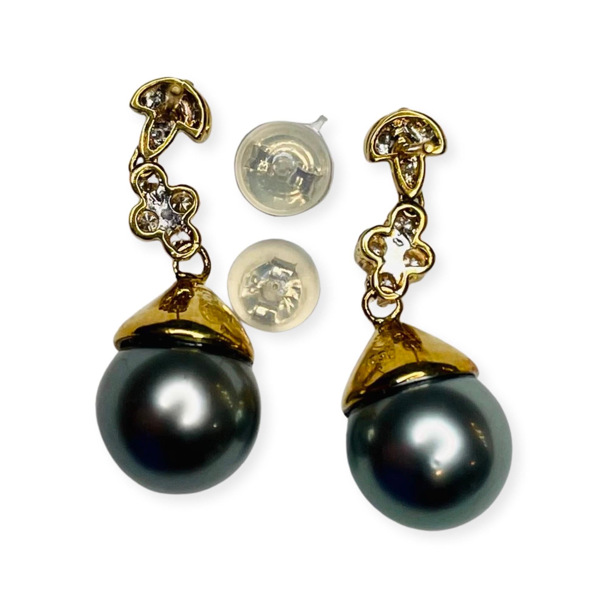 Lithos 18K Yellow Gold Diamond and Natural Color Black Tahitian Pearl Earrings. The pearls are 9.0 mm x 9.5 mm. The pearls are round, with slight blemishes and high luster. They have a greenish purple overtone. They are 27.0 mm long. There are 24