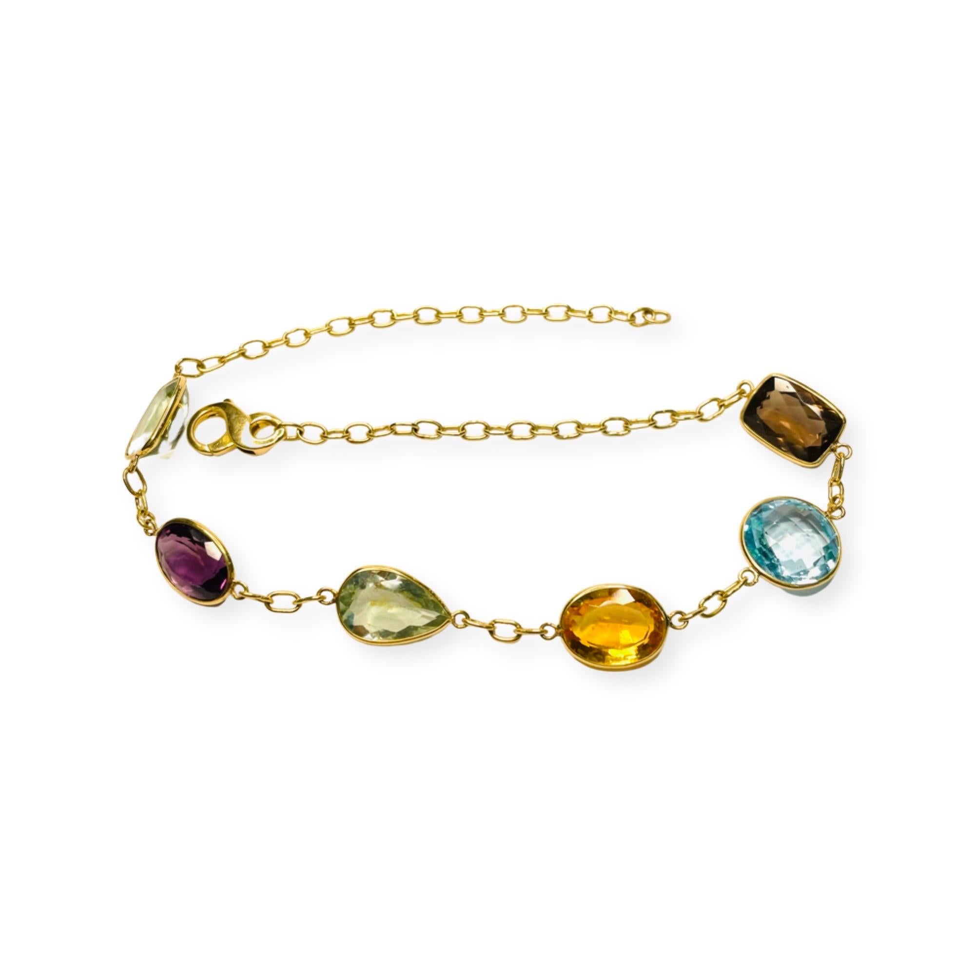 Lithos 18K Yellow Gold Handmade Smoky Quartz, Blue Topaz, Citrine, Amethyst and 2-Green Quartz Necklace. This necklace is handmade, including the solid link chain. The links are 5.5 mm x 4.5 mm. It terminates with a lobster closure. The gemstones 
