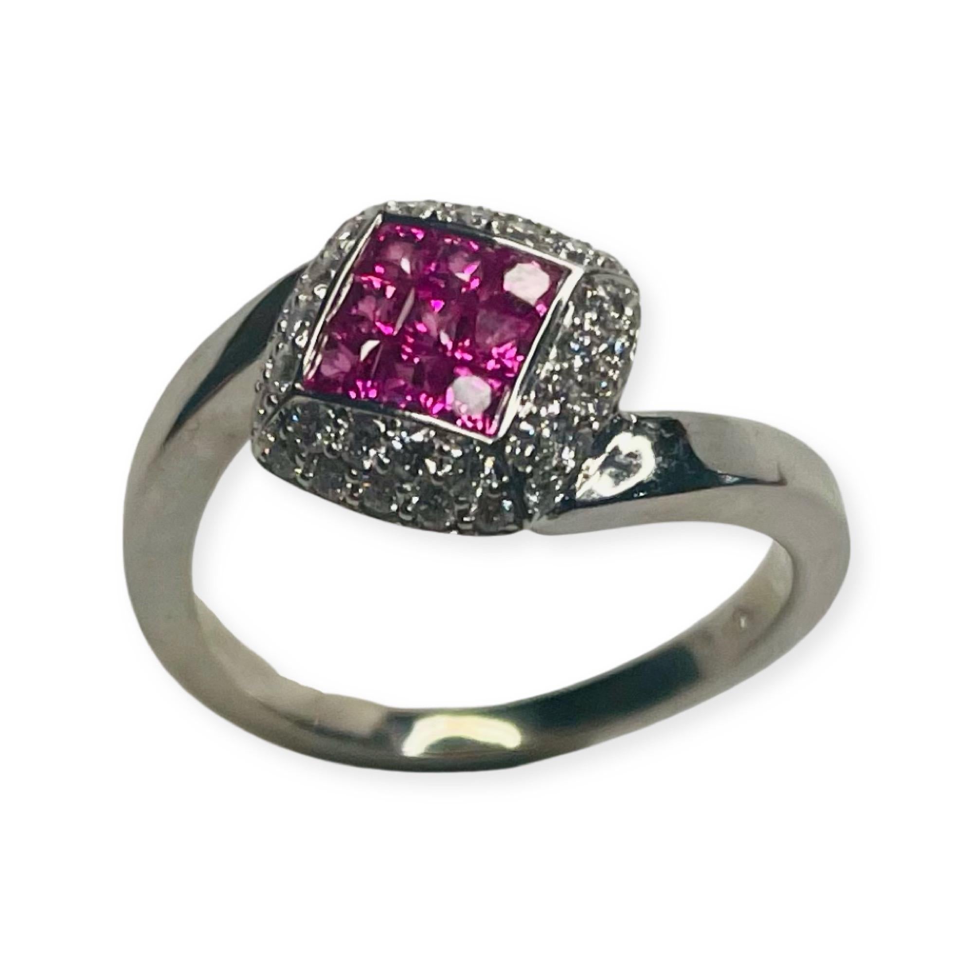 Lithos 18K White Gold Ring with Invisible Set Natural Pink Sapphires and Diamonds. There are 9 natural pink sapphires, invisibly set, for a total carat weight of 0.57 carats. There are 36 full cut round brilliant diamonds for a total diamond weight