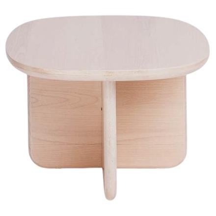 Our Lítica side table, a piece inspired by the earliest human tools known as choppers from the Lithic period.
Crafted from solid beech wood, this sculptural table is composed of three interlocking elements, shaped through precise cuts and
