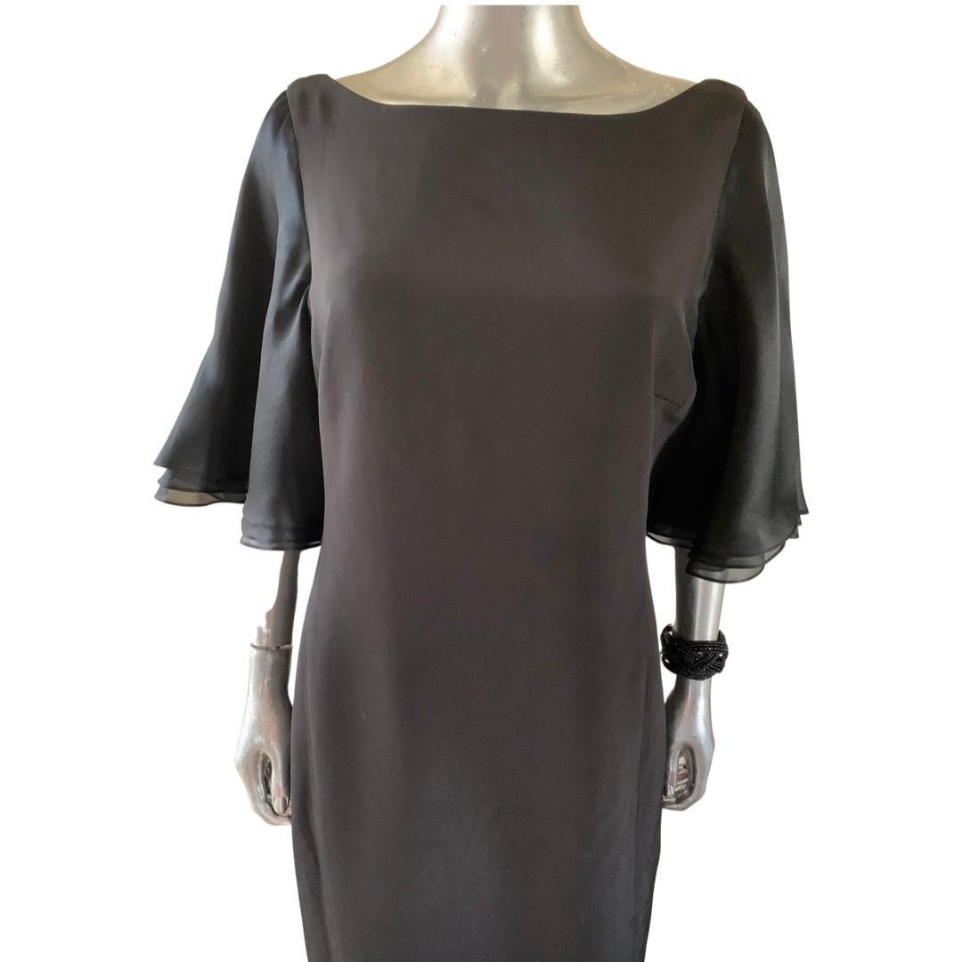 From our “ Little Black Dress” collection, a Worth New York black silk chemise. This plus size 14 Petite is a black silk chemise with 3 layered black organza sleeves. A flattering scoop neck back with center back slit. Dress is made beautifully. 