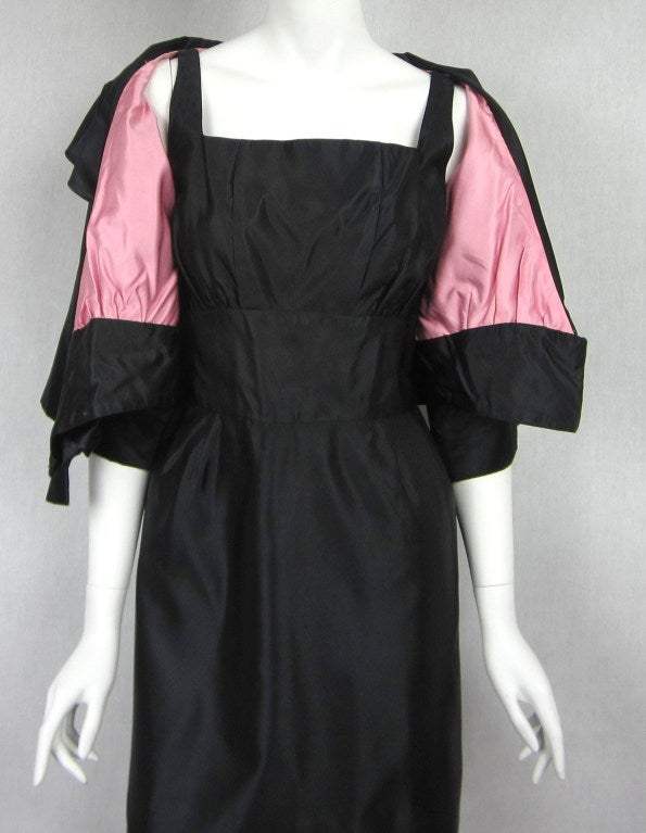 Stunning 2 piece Vintage Taffeta 1960s Dress with matching jacket *Tight fitting Wiggle Dress *Jacket has an amazing wide collar and Dolman Sleeves and a stunning pink lining *Tight fitting on your waist. Attention to detail is wonderful on this