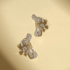 Little Bow Studs Featuring Approximate 2 Carat Emerald Cut Diamond