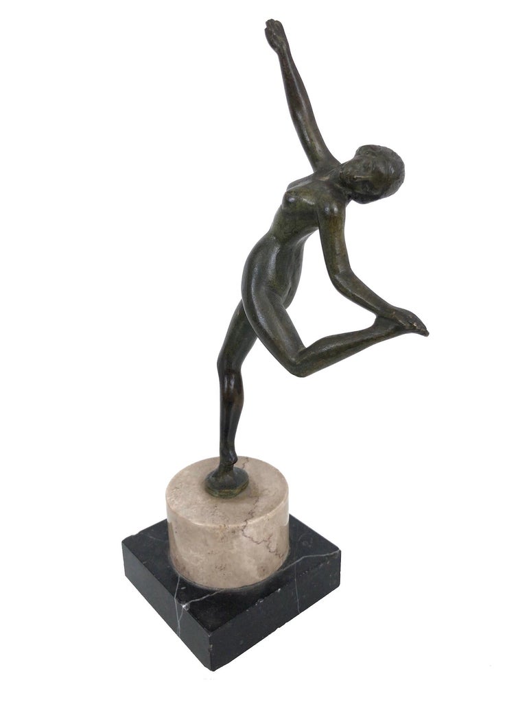 Little dancer 
Sculpture in bronze on a socle of natural stone 
Original Art Deco, France, 1930s.

Dimensions:
Width 11 cm
Height 24 cm
Depth 7 cm.