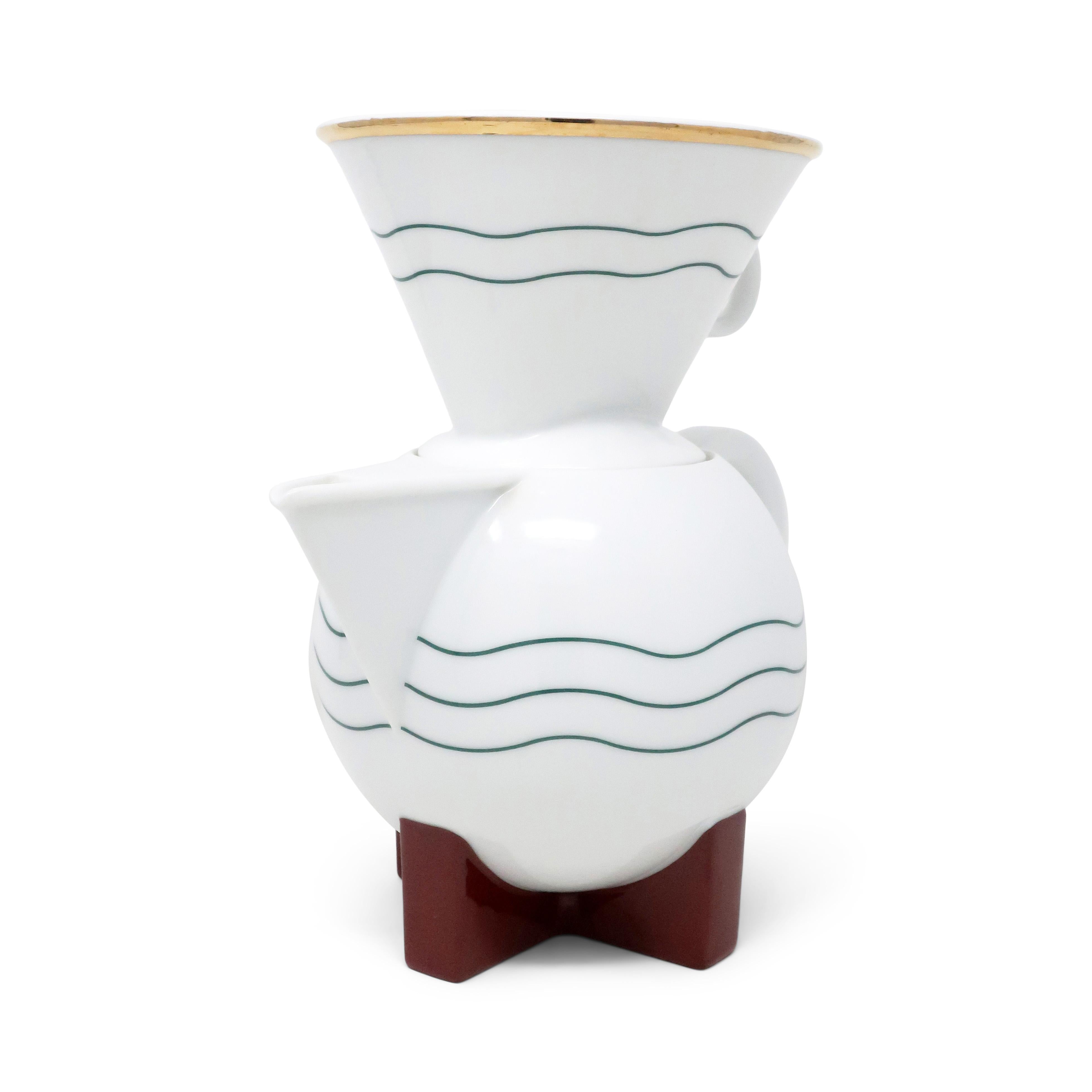 Perhaps Michael Graves’ (1934-2015) most well-known design for Swid Powell, The Little Dripper (1986) is a 10 cup coffee pot born from Graves’ preference for drip coffee and a lack of available drip coffee makers that met his aesthetic standards.