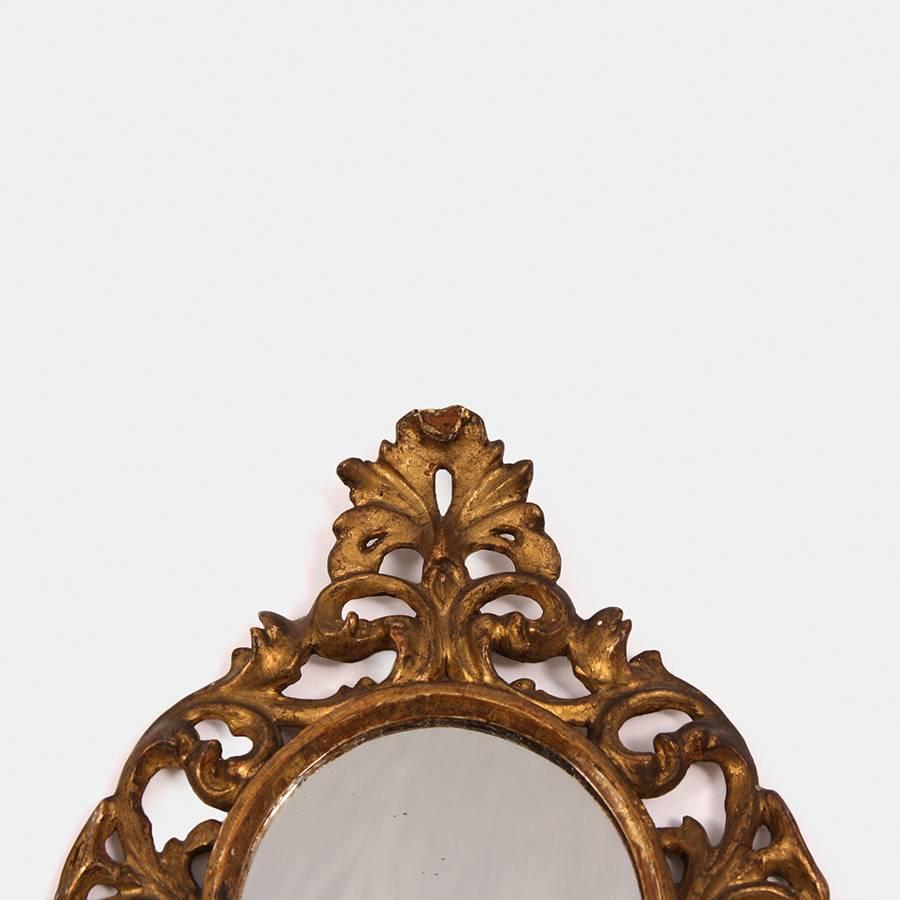 A lovely little gilded Florentine mirror.

This would look great in amongst pictures or in little hallway nooks.