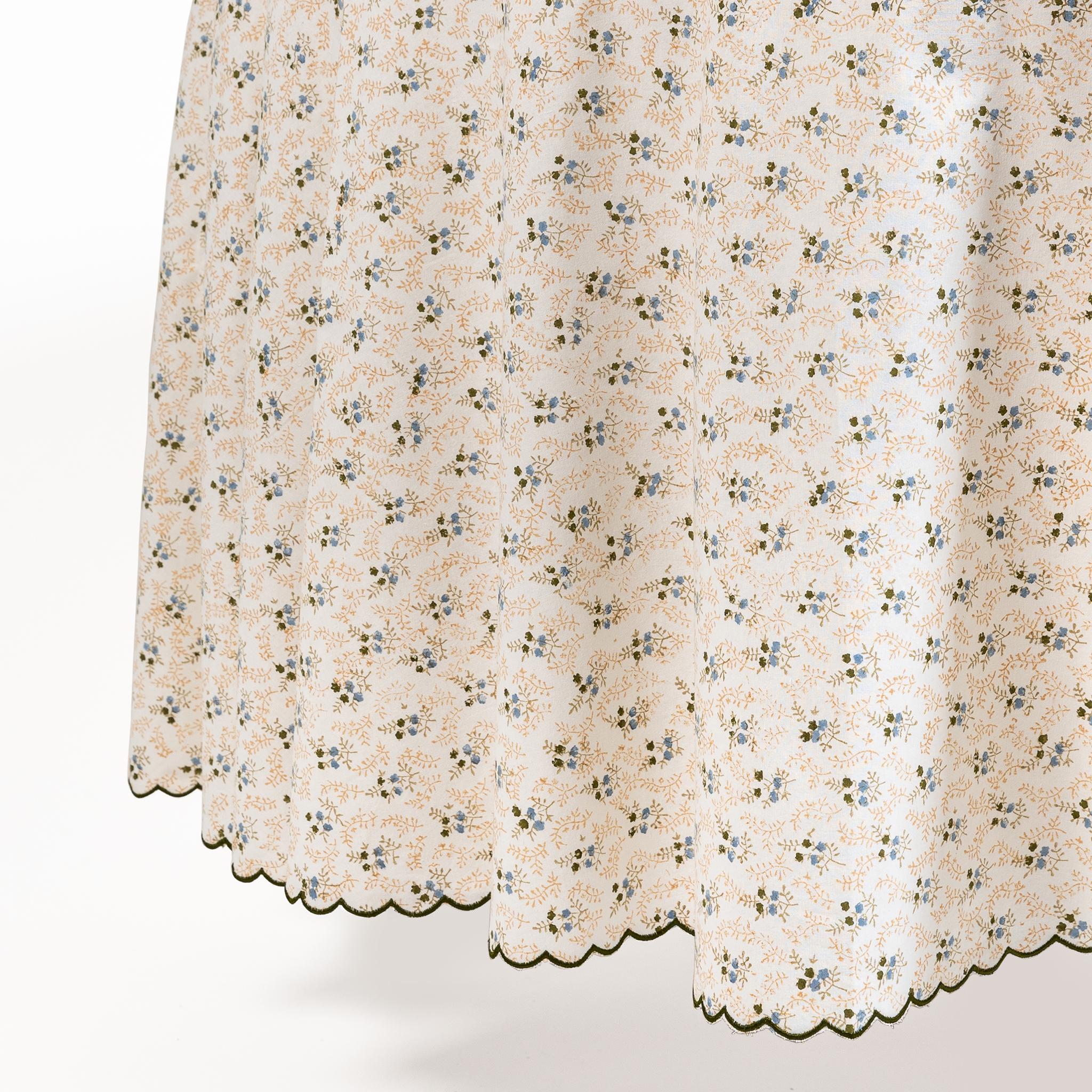 Our Little Flower collection features a beautiful ditsy floral print and comes in three colourways: Blue, Green and Maroon. Hand-blocked by artisans onto 100% cotton, the tablecloths are edged with a chic scalloped border. Add a fresh splash of