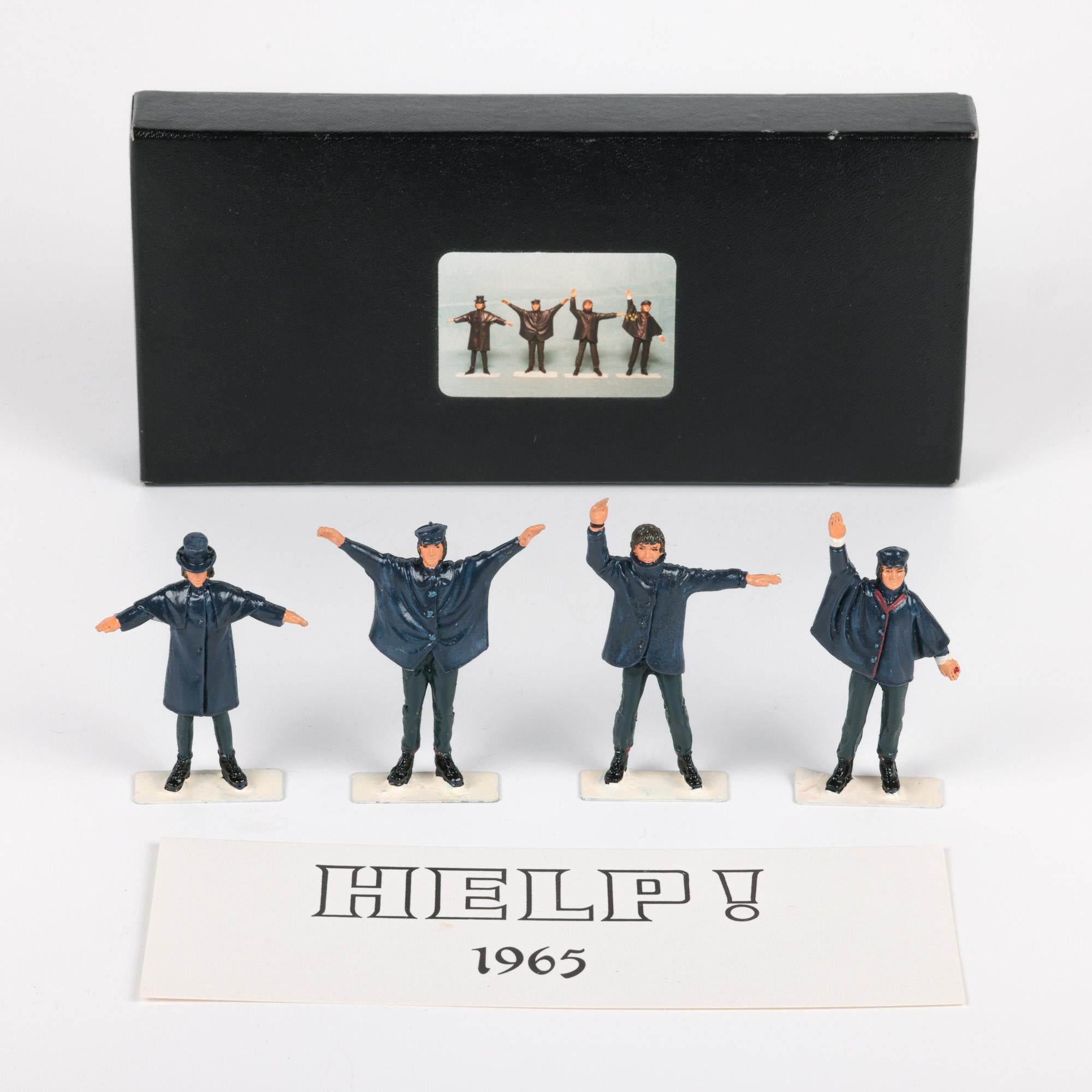 A British made vintage boxed set of lead figures of the Beatles and produced in conjunction with their album HELP! and made by Little Lead Soldiers around 1965. This fine collectors set is  hand crafted and hand painted in coloured enamels