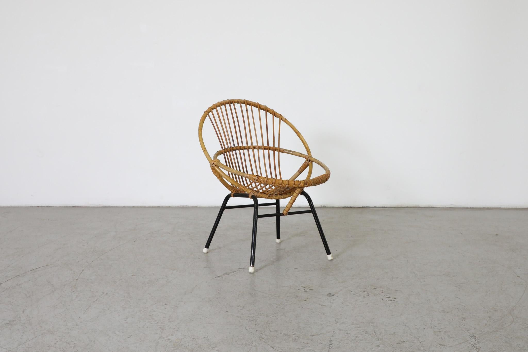Cute little bamboo hoop chair with black enameled frame and white foot caps. Design attributed to Dutch Mid-Century icon Dirk van Sliedregt, renowned for his work that combined rattan and bamboo with sleek Mid-Century esthetics. In original