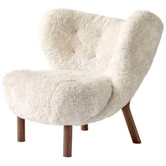 Little Petra Lounge Chair in Sheepskin with oiled Walnut Frame by & Tradition