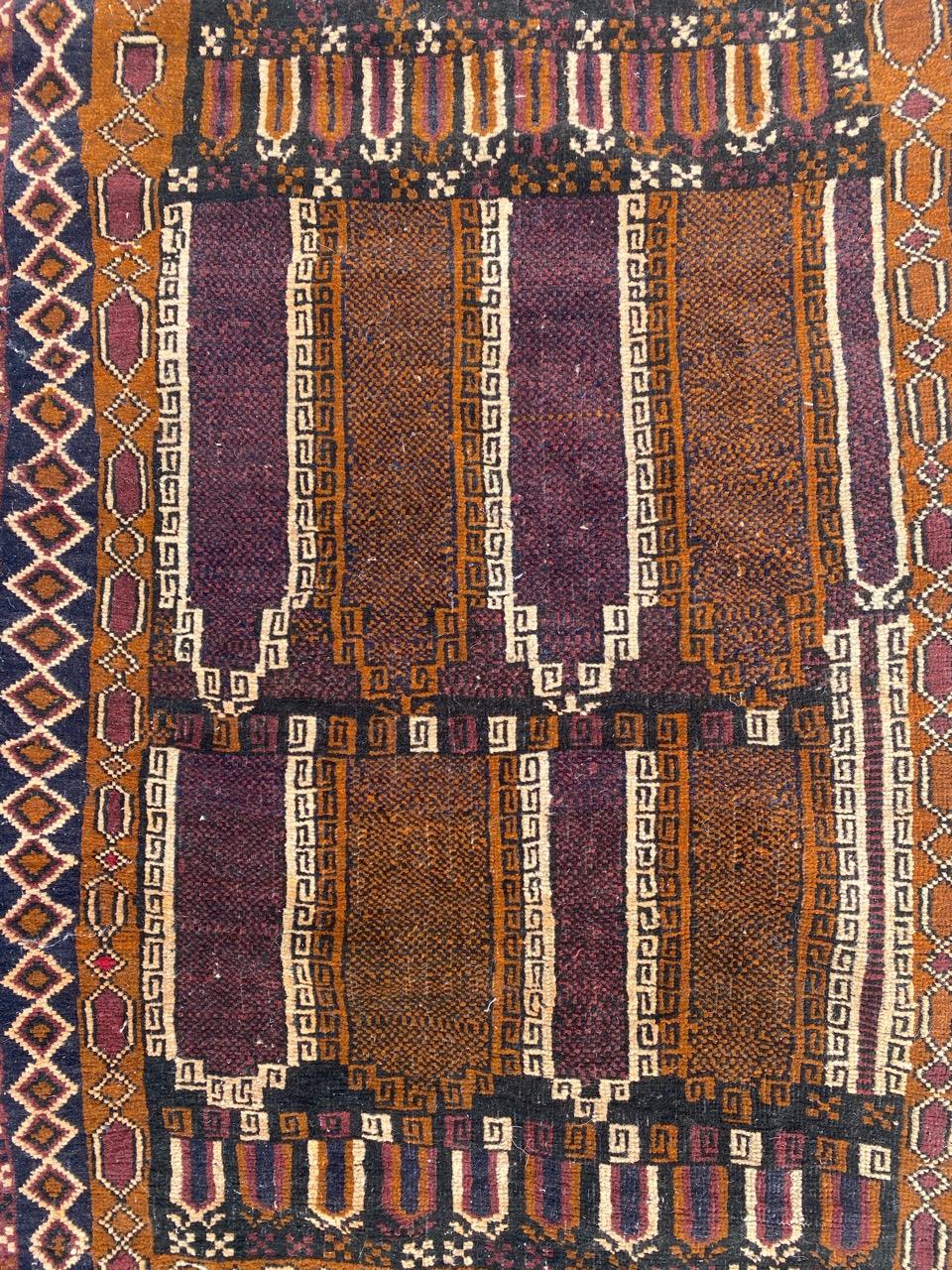 Nice tribal Baluch Afghan rug with geometrical design and nice colors, entirely hand knotted with wool velvet on wool foundation.