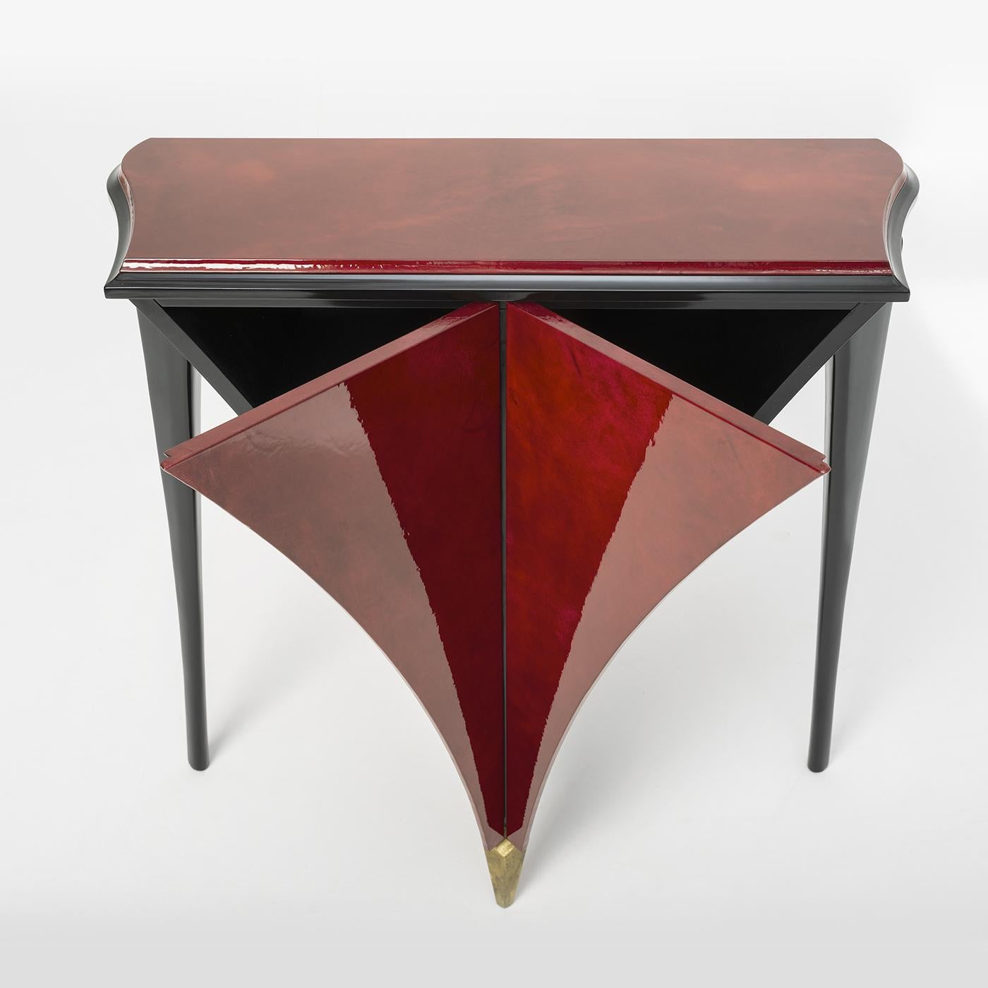 Stylish and unique in design, the Liù console table features a central part and top in gloss red goatskin parchment. The side leg and border are lacquered in matte black, while the central leg is embellished with oxidized gold leaf for a touch of