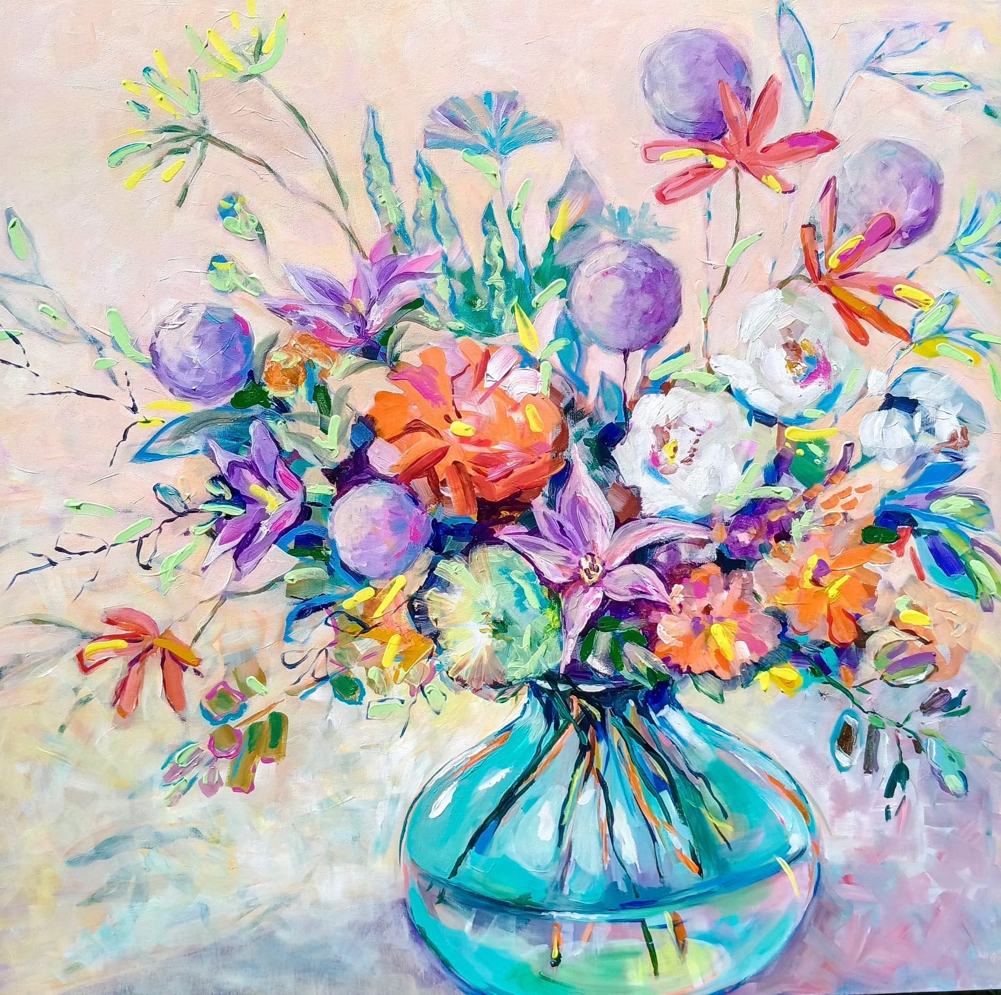 "A festive bouquet in a glass vase."