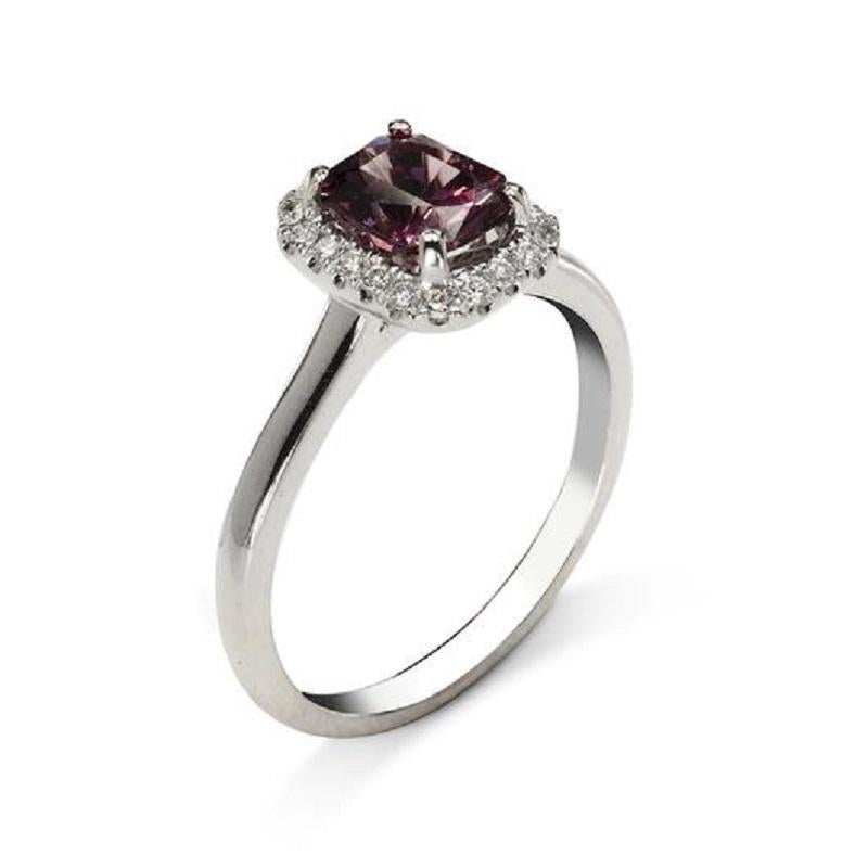 Liv is a beautiful violet pink spinel ring created by Mike Nekta in NYC. 

Center Stone: Violet Pink Spinel

Carat Weight: 1.08

Shape: Radiant

Metal: 18K White Gold

Diamonds: F Color, VS, 0.16 ct total

Size: Can be adjusted to any size

Made in
