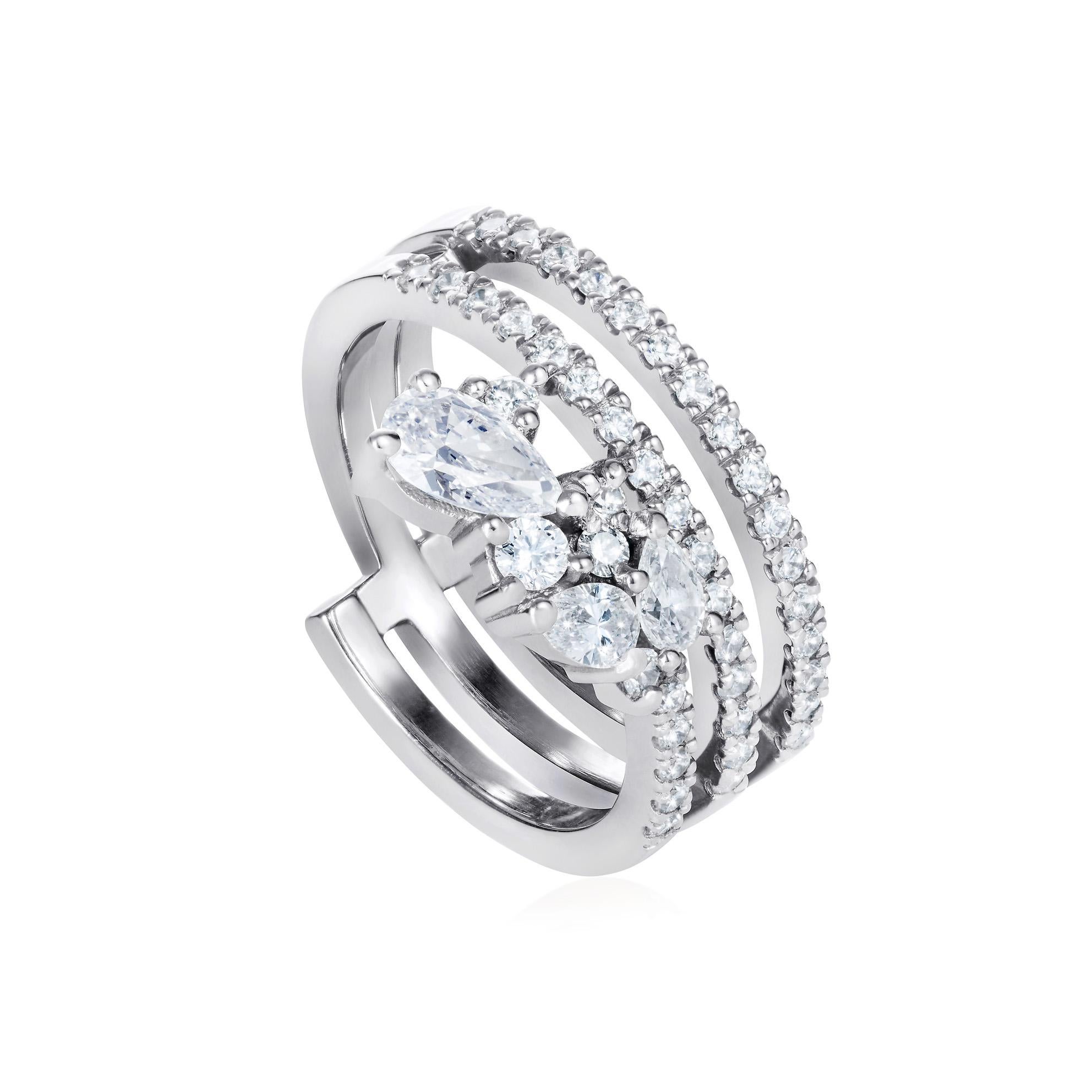 The two  fine white gold diamond studded bands of this ring give the structure that then ‘dissolves’ into  7 beautiful larger stones that flow into a soft organic shape.

This ring can be worn with the fall of stones going down the hand or up the