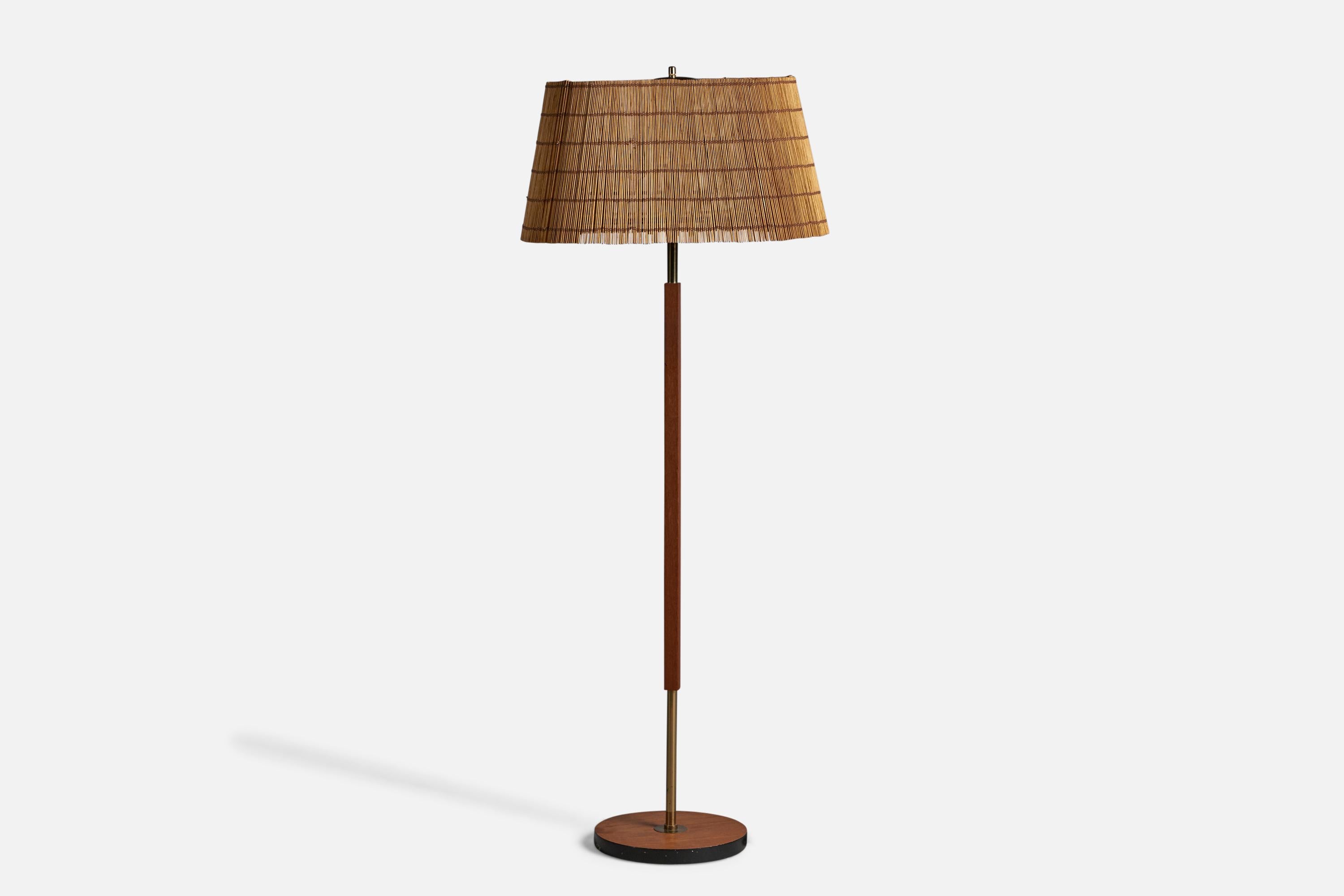 A brass, wood and reed floor lamp, designed and produced by Lival OY, Finland, 1950s.

Overall Dimensions (inches): 54.5