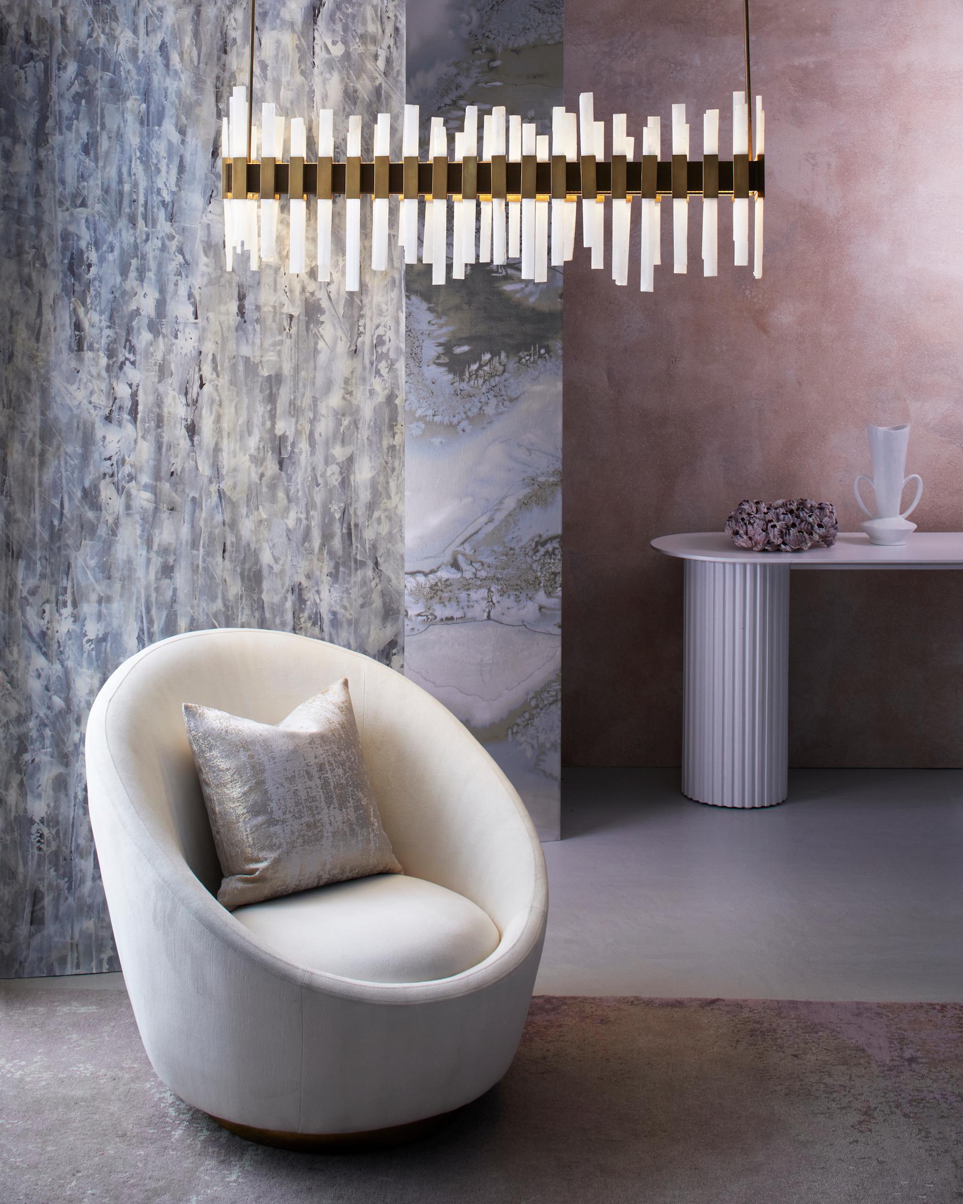 Our beautiful Livara chandelier is delicately handcrafted in bronze with rectangular rock crystal rods adorning the bespoke bronze frame. Seen here in our popular Antique Brass finish, we can amend measurements to suit your needs. It sits