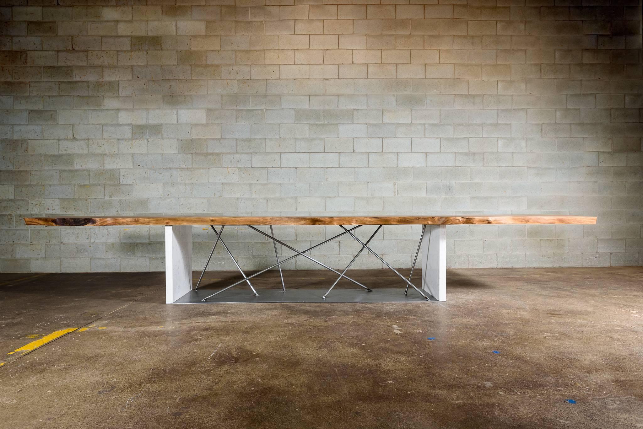 16FT conference table in a single black walnut slab is a must in any conference room. The mariage between black walnut and cambria quartz torquay brings warmth to the room. Our motto, Enhancing wood’s natural beauty has been achieved with this