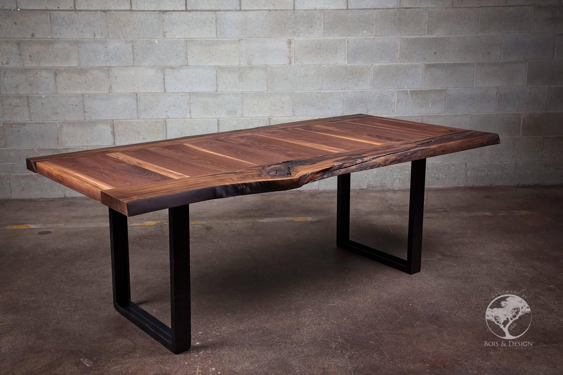 This black walnut dining table has been laminated in 2 different directions.  It sits on U shape steel legs.  We call it ''la transversé'' because the wood joined in two different directions. We let nature design with the curves, cracks and holes