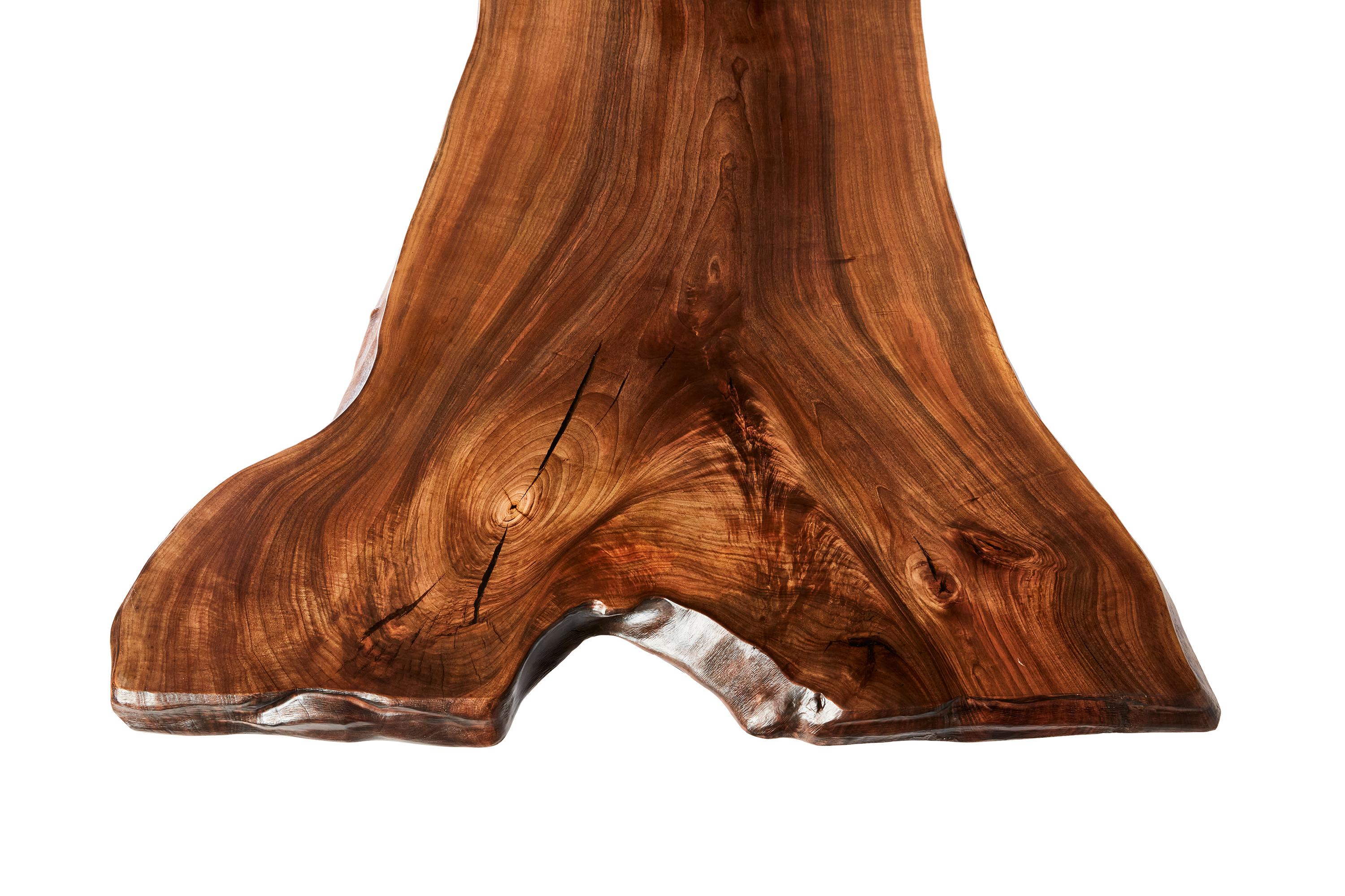 The stunning walnut table shown here was made in Ankara, Turkey with wood gathered walnut wood from the forests of the Mediterranean. The wood is kilned and dried prior to being filled with high quality resin in areas of natural cracking. 

This
