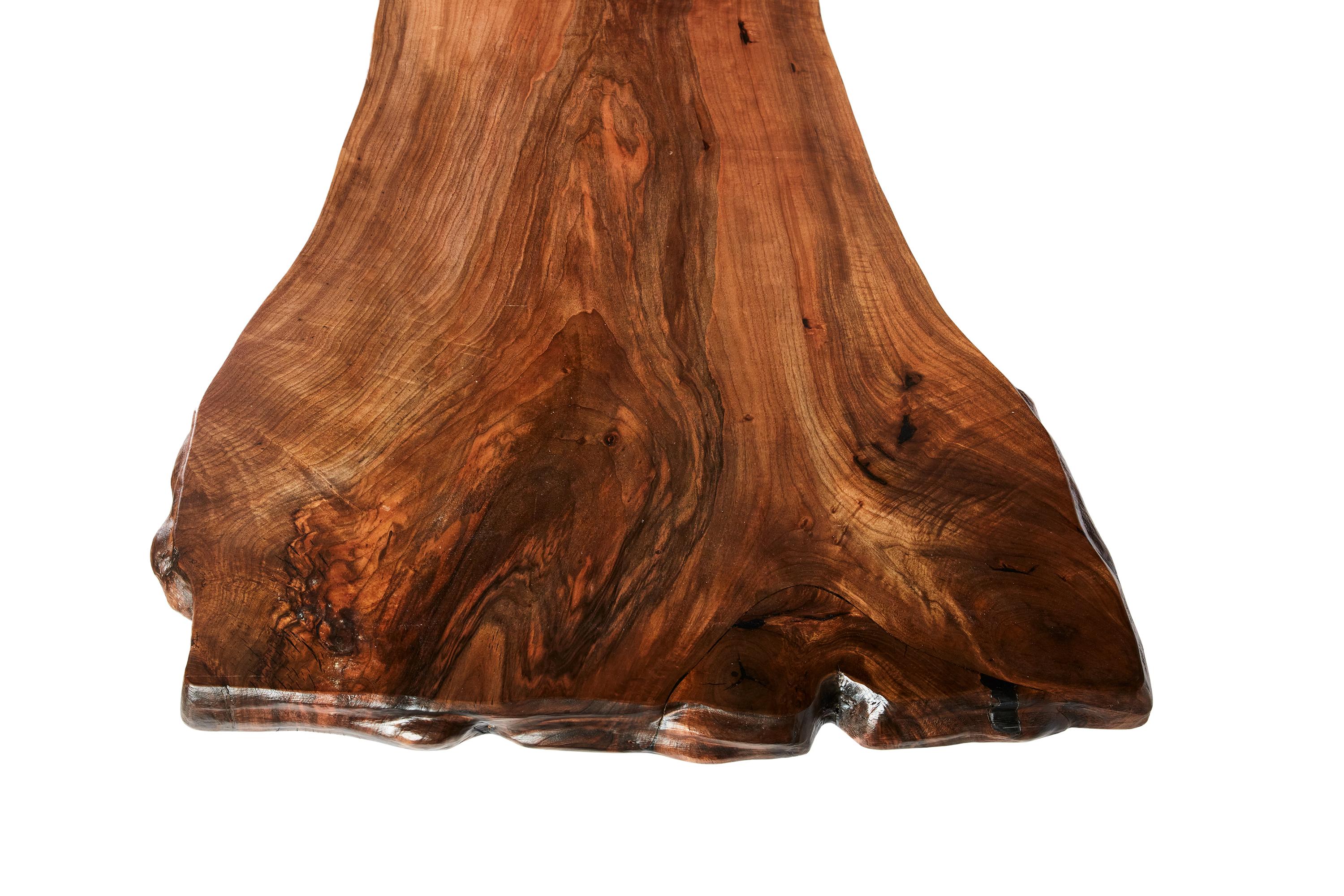 The stunning walnut table shown here was made in Ankara, Turkey with wood gathered walnut wood from the forests of the Mediterranean. The wood is kilned and dried prior to being filled with high quality resin in areas of natural cracking. There are