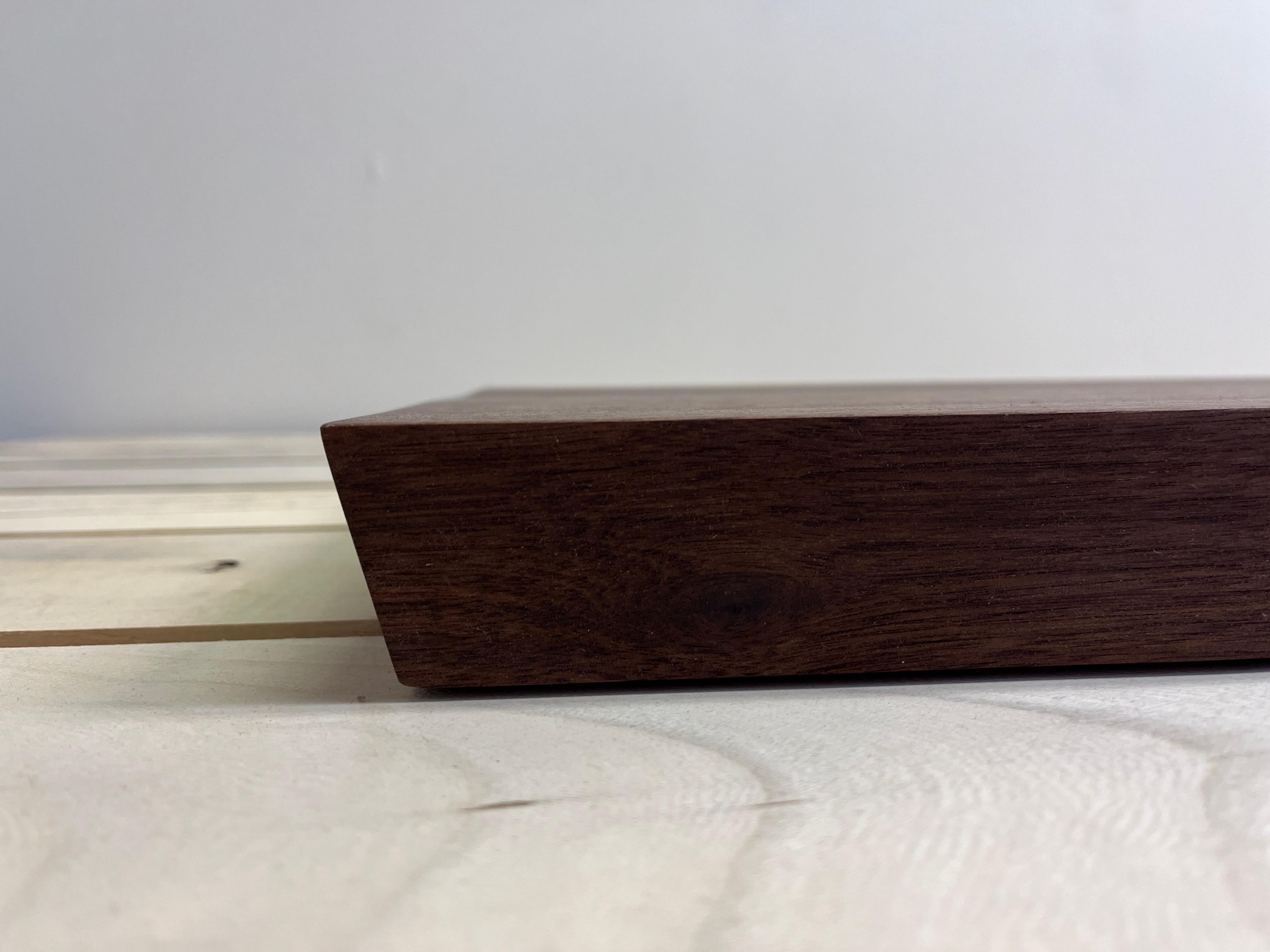 A live edge walnut charcuterie board brings a piece of the urban forest into your kitchen or home. Paired with deliciously-styled meat, cheese, fruit, appetizers or hors d'oeuvres, a thick piece of urban hardwood, like this charcuterie board is the