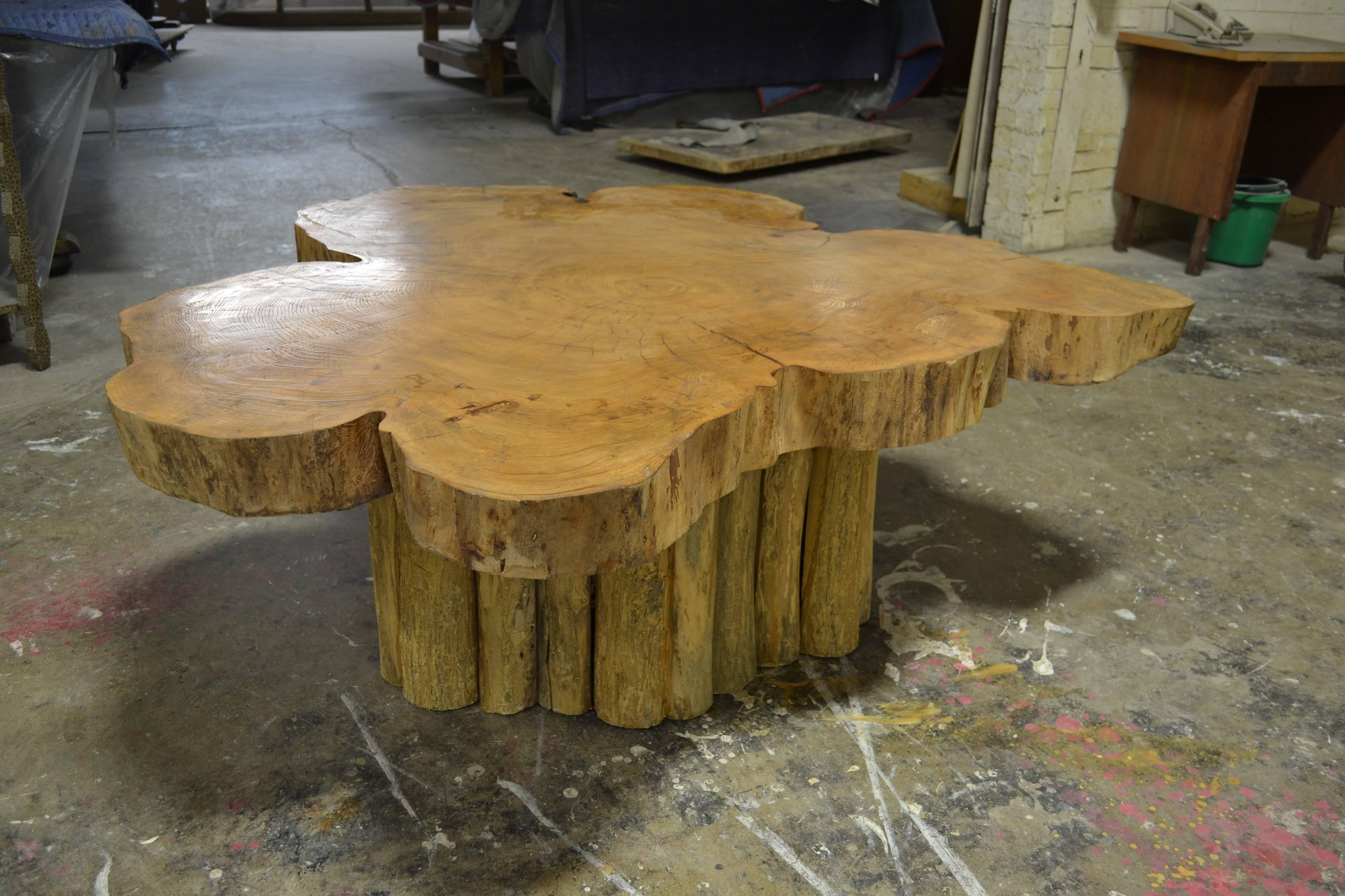 The live edge coffee table was designed by Joann Westwater. The tabletop is a 3 1/2