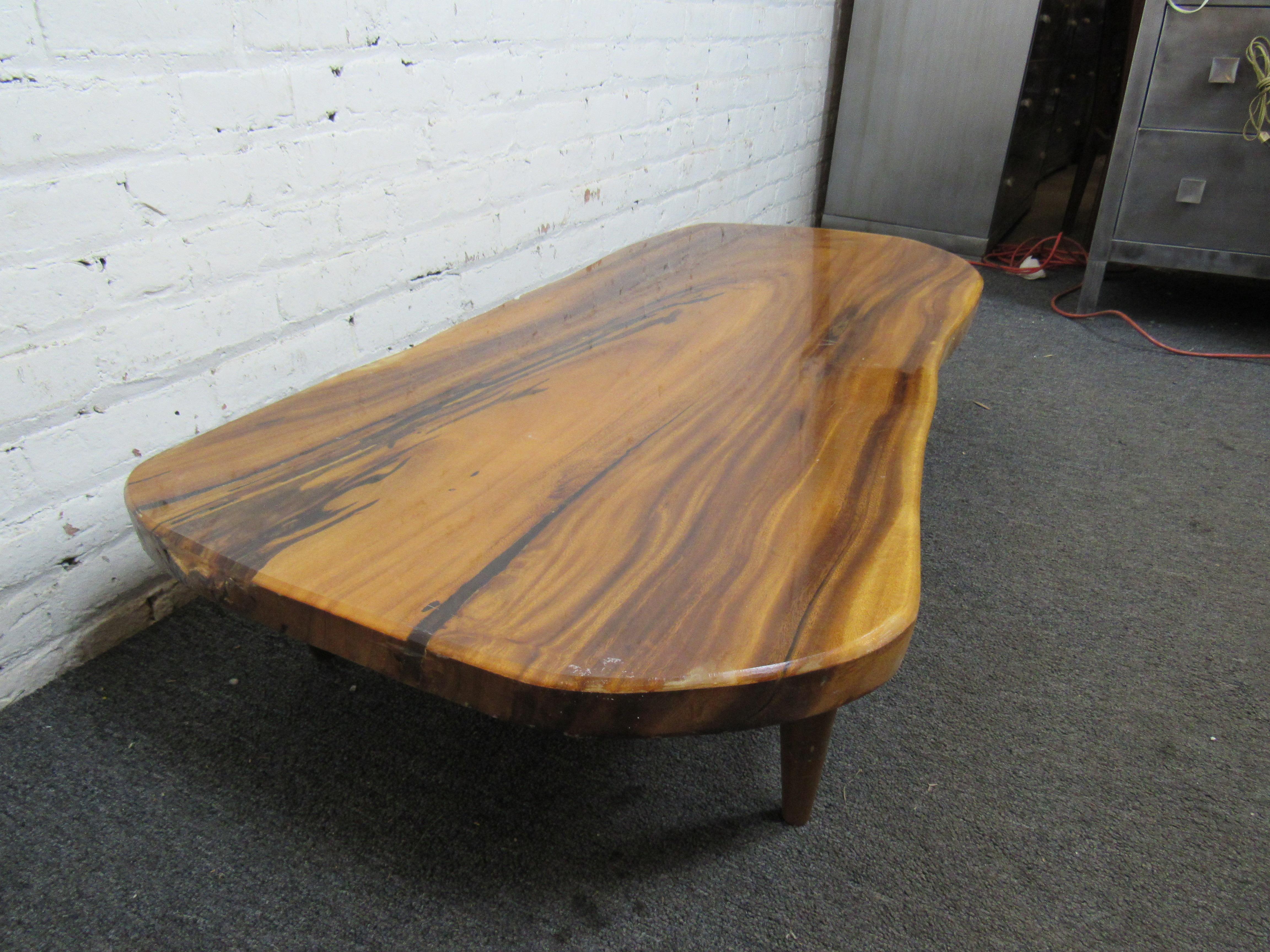 Beautiful live edge coffee-table with a glossy finish. 
(Please confirm item location - NY or NJ - with dealer).
 