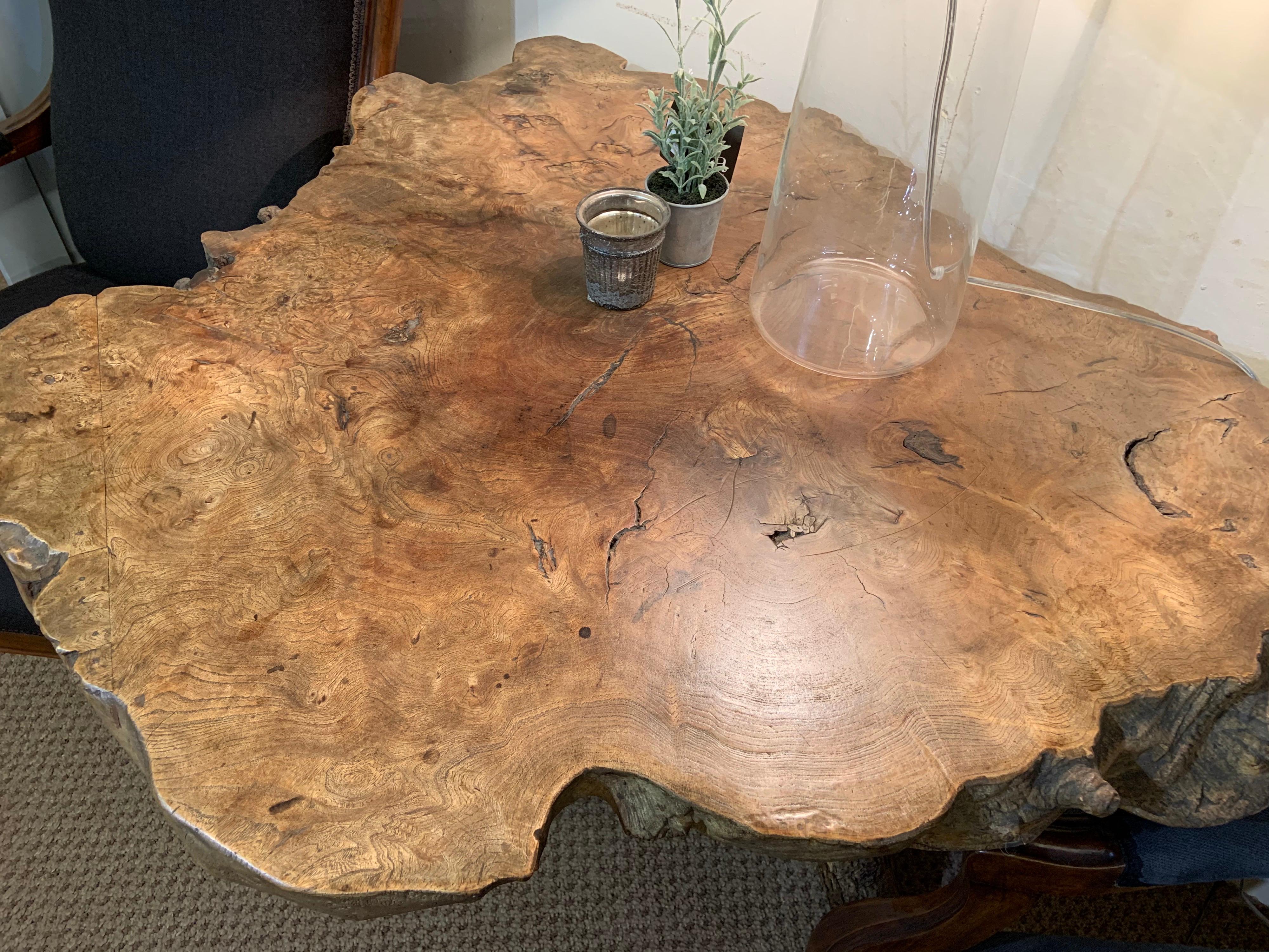 Live edge elm table with exquisite top. Stands on three leg trunk. Absolutely stunning table with a lot of character.