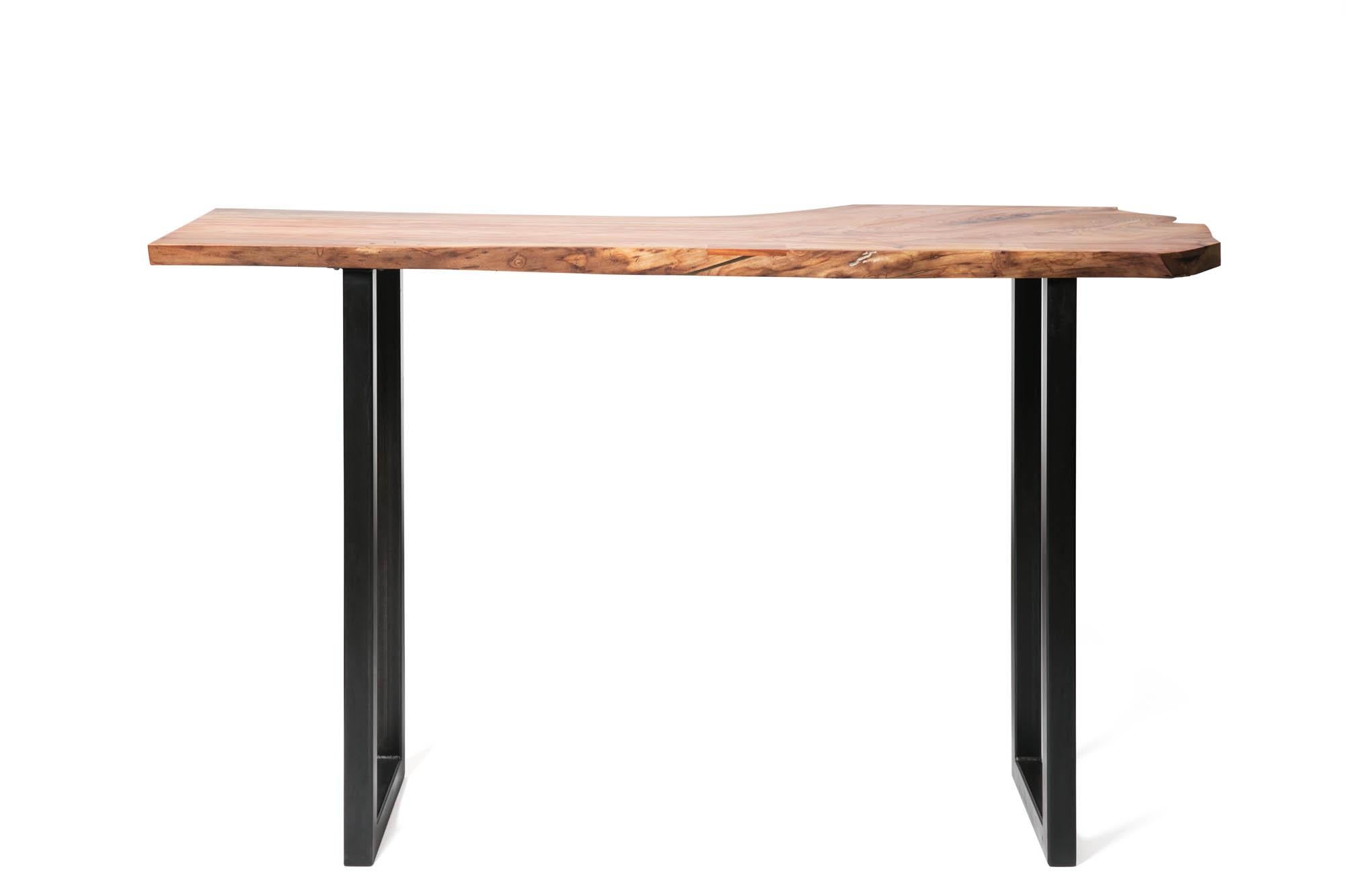 Our Live Edge Bar Height Table in Pecan Wood and Blackened Steel combines minimalist and rustic design elements.  The distinct grain of urban timber, locally harvested in Birmingham, Alabama, plays off the elegant and modern Sunrise base.  This bar
