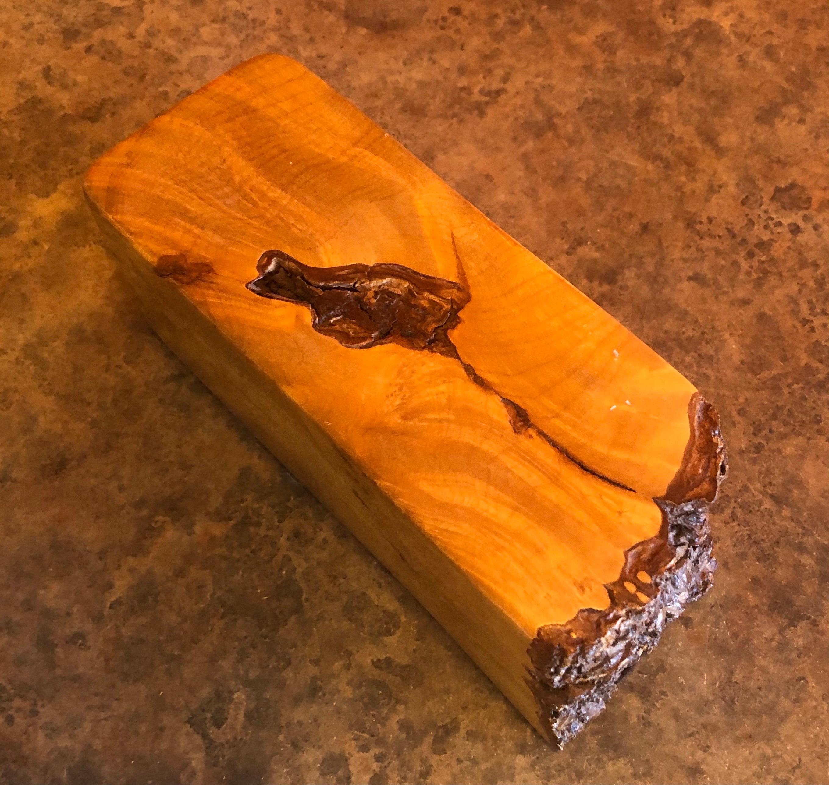 A highly sculptural studio crafted live edge maple burl wood trinket box, circa 1980s. The box has a removable lid and measures 7.25