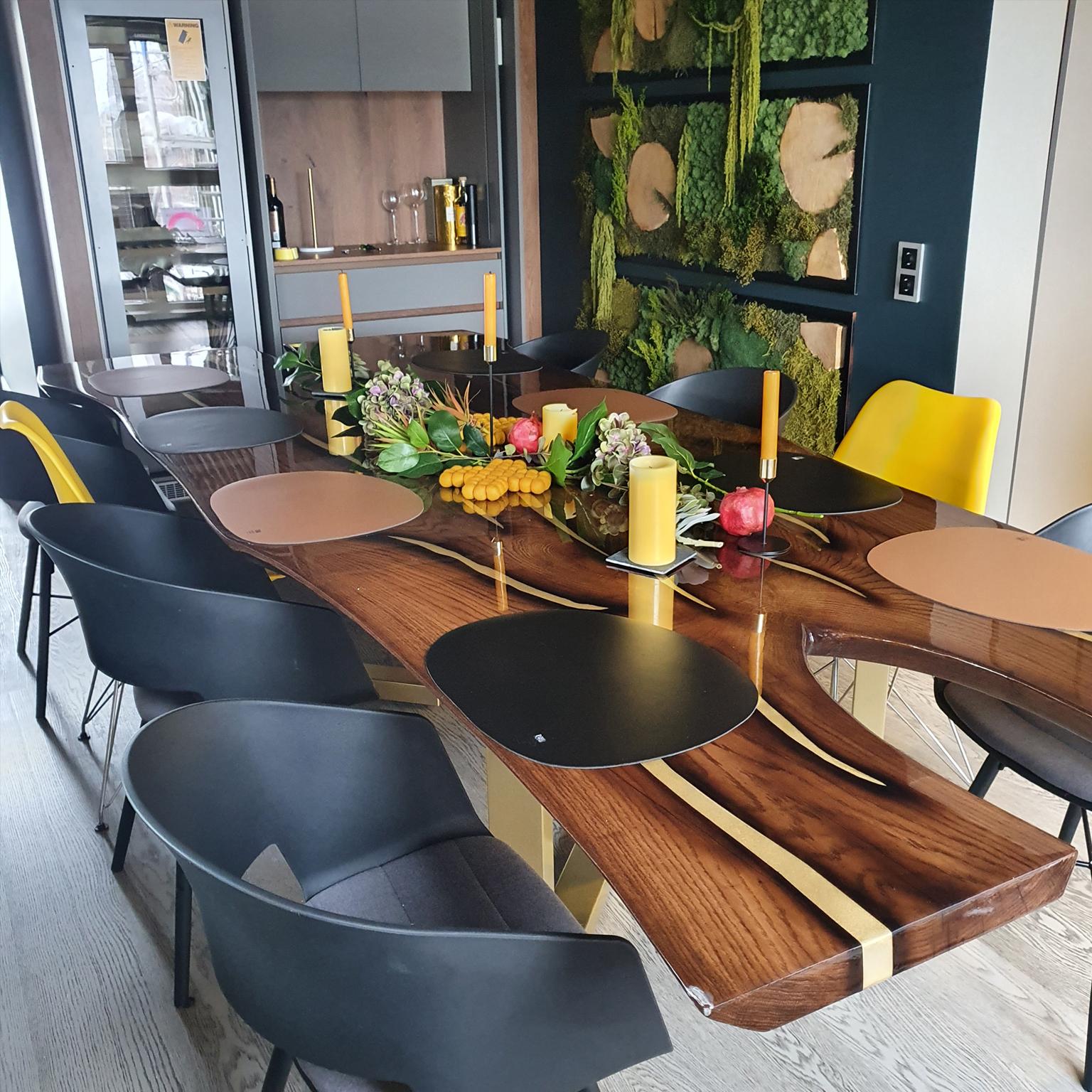 An eye-catching interplay of shapes and proportions, this dining table encompasses fine craftsmanship and an innovative design that will enhance any modern dining room. This modern live edge dining table is handmade from old, reclaimed oak with many