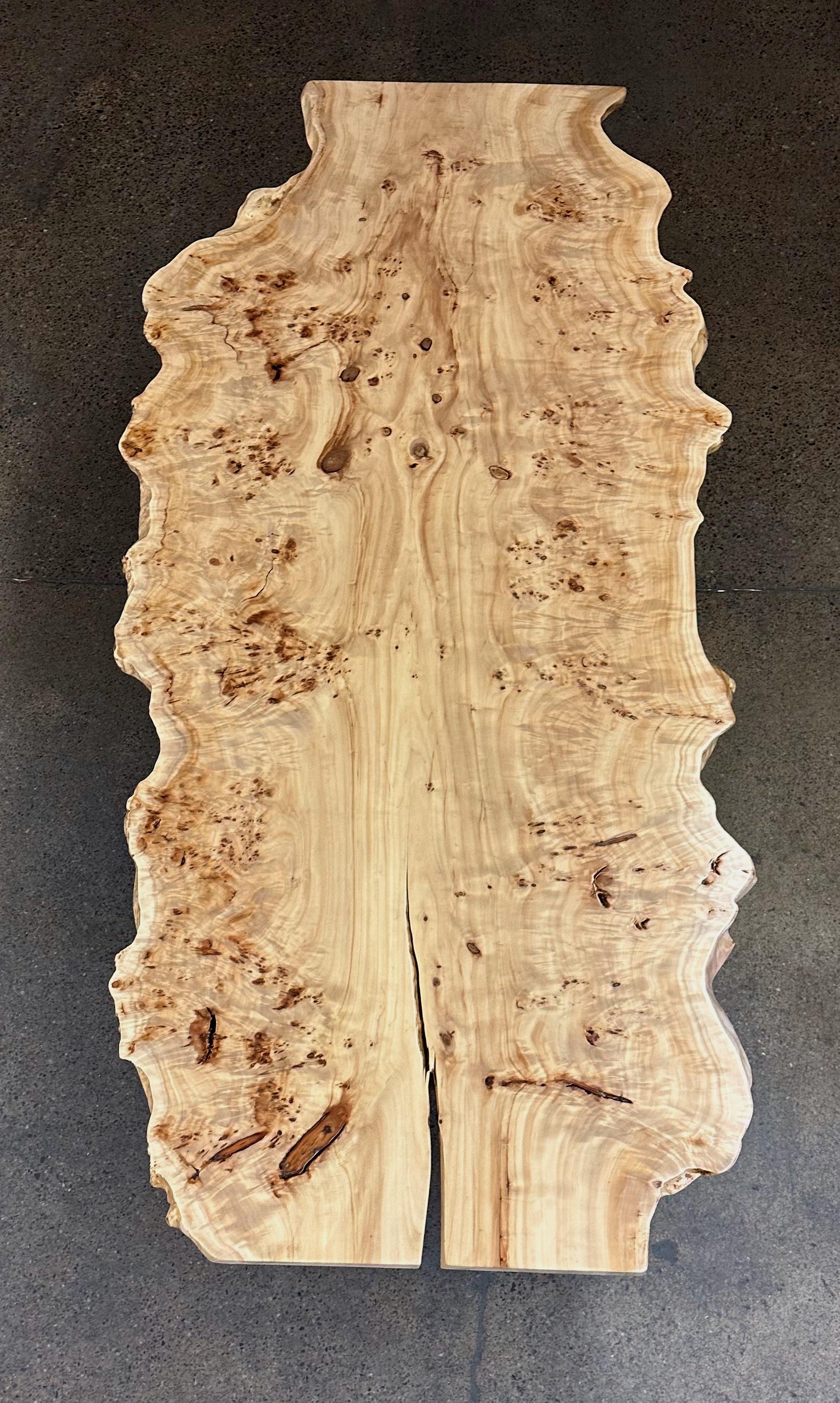 This was our first time hearing of mappa burl - our client came to us with that name asking if we could find a slab to make a dining table for them and after digging into a few of our suppliers, we came up with this spectacular piece. Raw edge slab