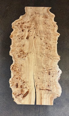 Live edge mappa Burl dining table with custom powder coated leg