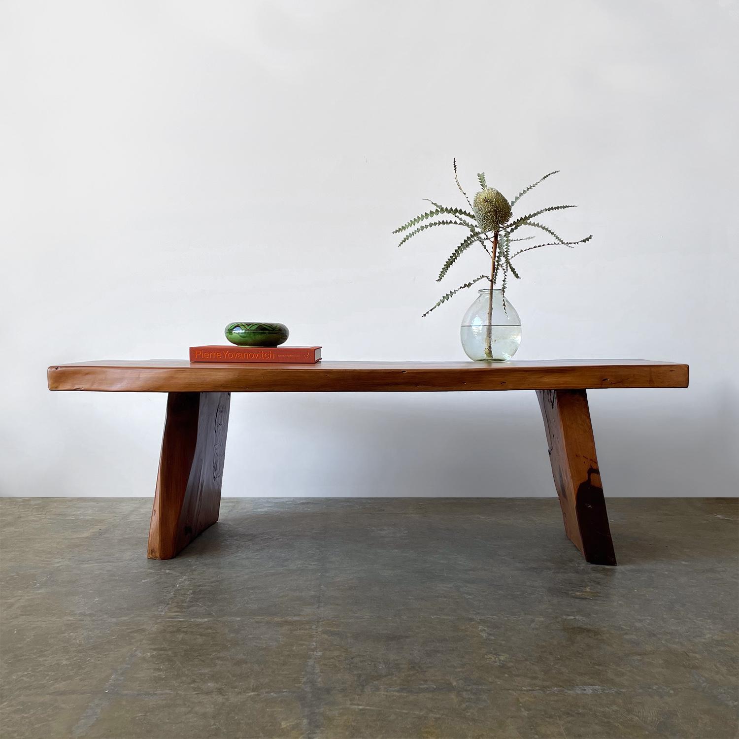 Live edge mid century coffee table 
Beautiful rustic piece
Handcrafted table constructed of thick cut wood slabs
Organic free form shape with a live edge
Beautiful grain detail with a rich chocolate brown swirl pattern throughout
Split in the