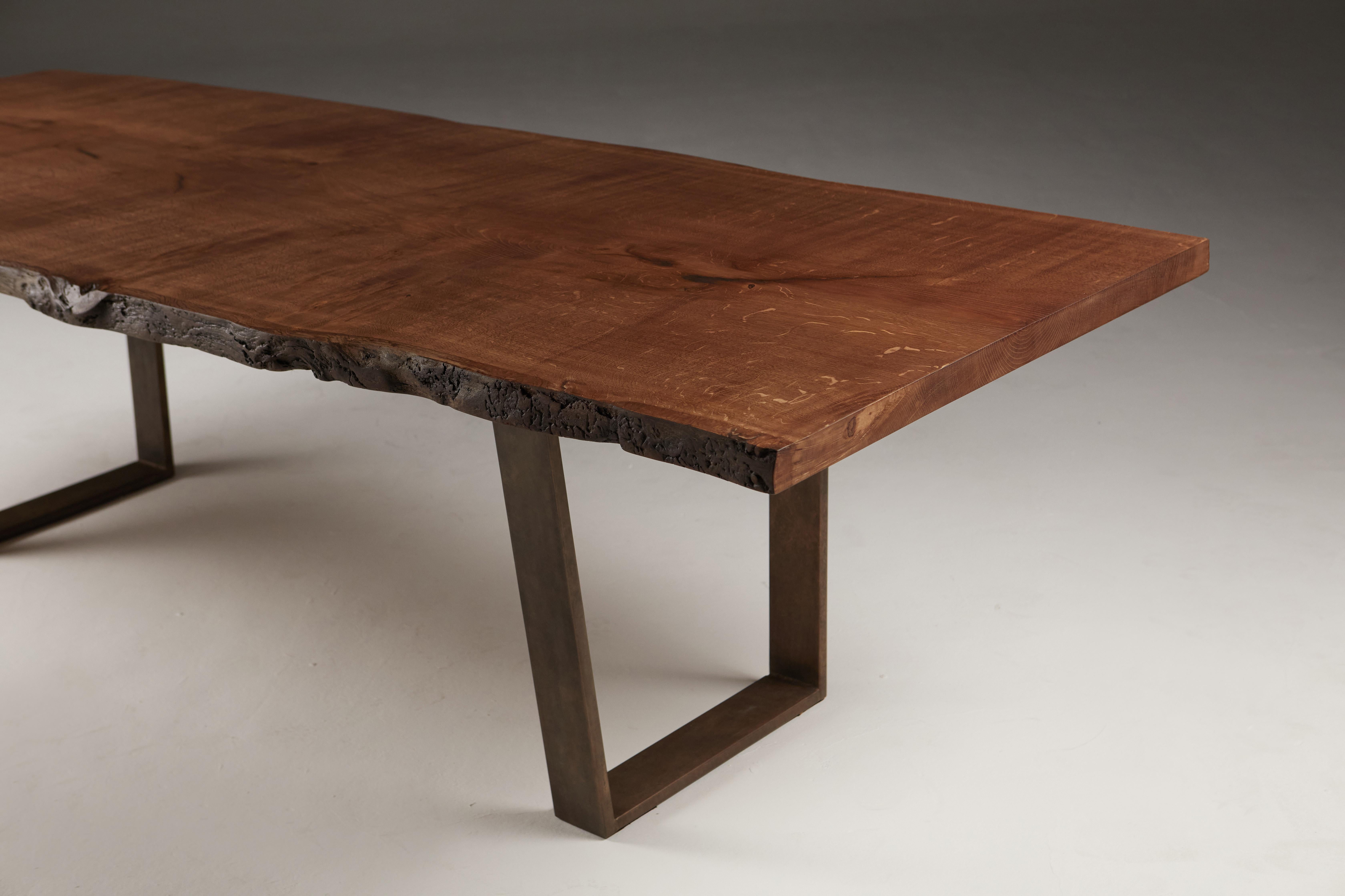 British Live Edge English Oak Dining Table on Bronze Trapeze Legs. For Sale