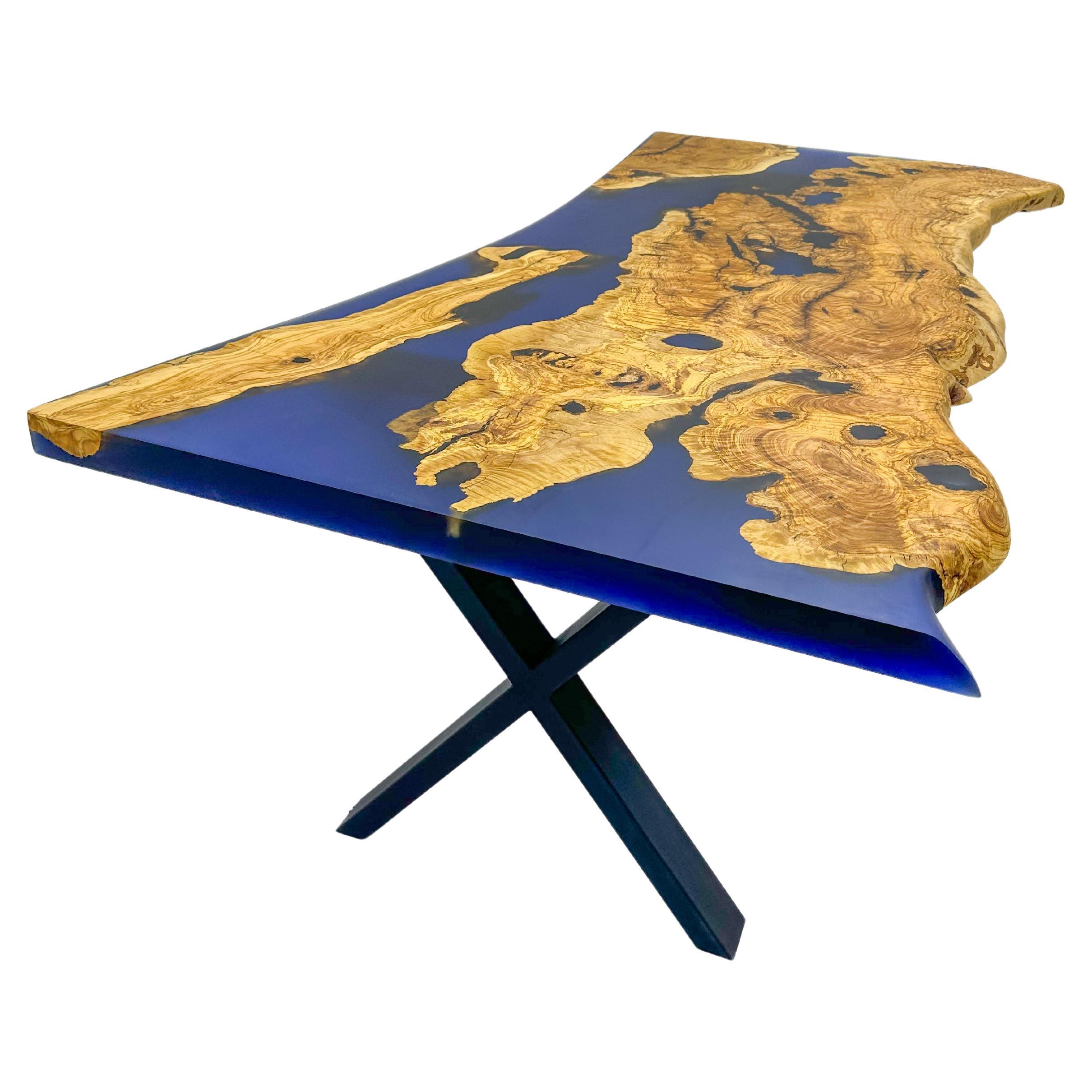 Custom Olive Epoxy Table

This stunning table is made of Mediterranean Olive wood. The unique beauty of the natural curves of olive wood combined with blue epoxy is seen in this table.

All woods have its own natural shape. Therefore, each one has