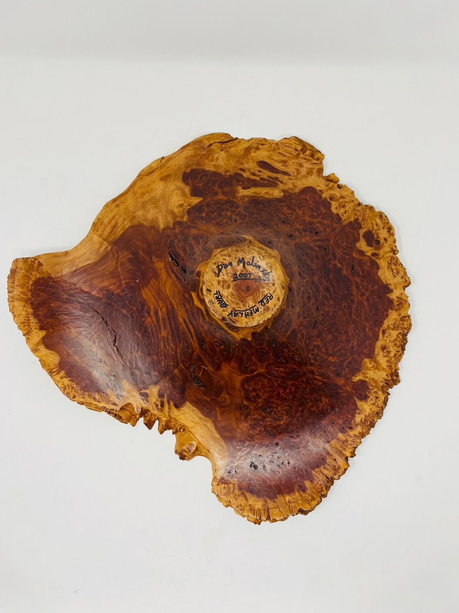 Incredibly sculptural live edge burl wood bowl.  This fantastic piece catapults to sculpture as it lines and natural structure elevate it to an object to feast on visually.  The wood patterns and raw edge add precise drama to the simple bowl shape.