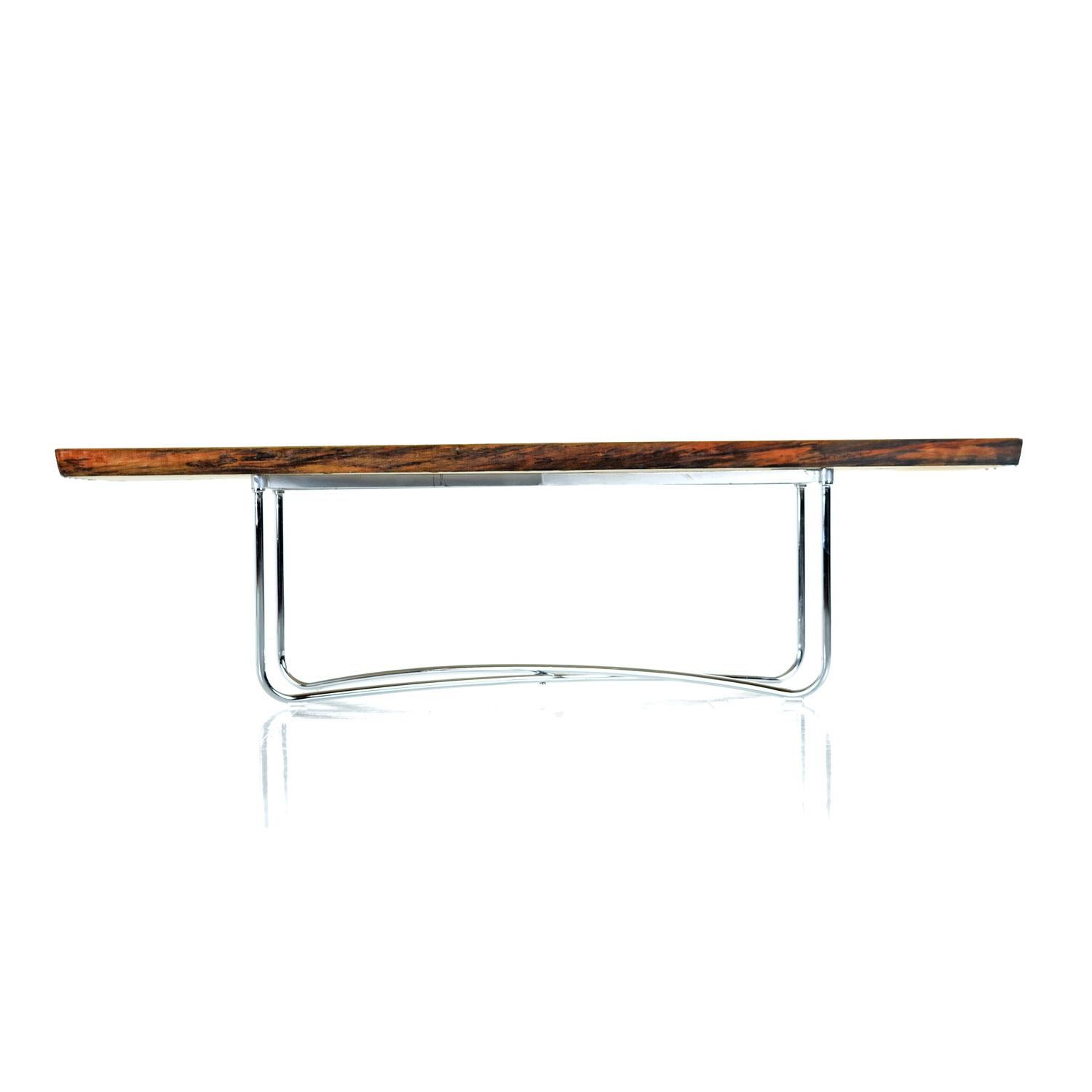 Spectacular live edge, pine plank coffee table bench. The aged pine has been renewed with a freshly poured, scratch free resin surface. The naturally formed knots and variations in the wood have smoothed over like glass. The edges are raw, unaltered