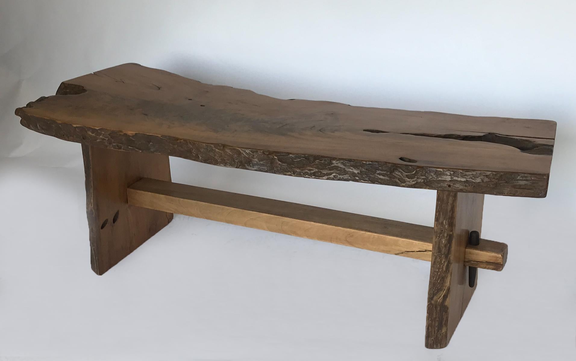 Very Nakashima- like bench or coffee table made from live edge teak. Great modern style, beautiful graining on wood top. 20th century Mortise and tenon with wood pins holding stretcher. Nice and sturdy.