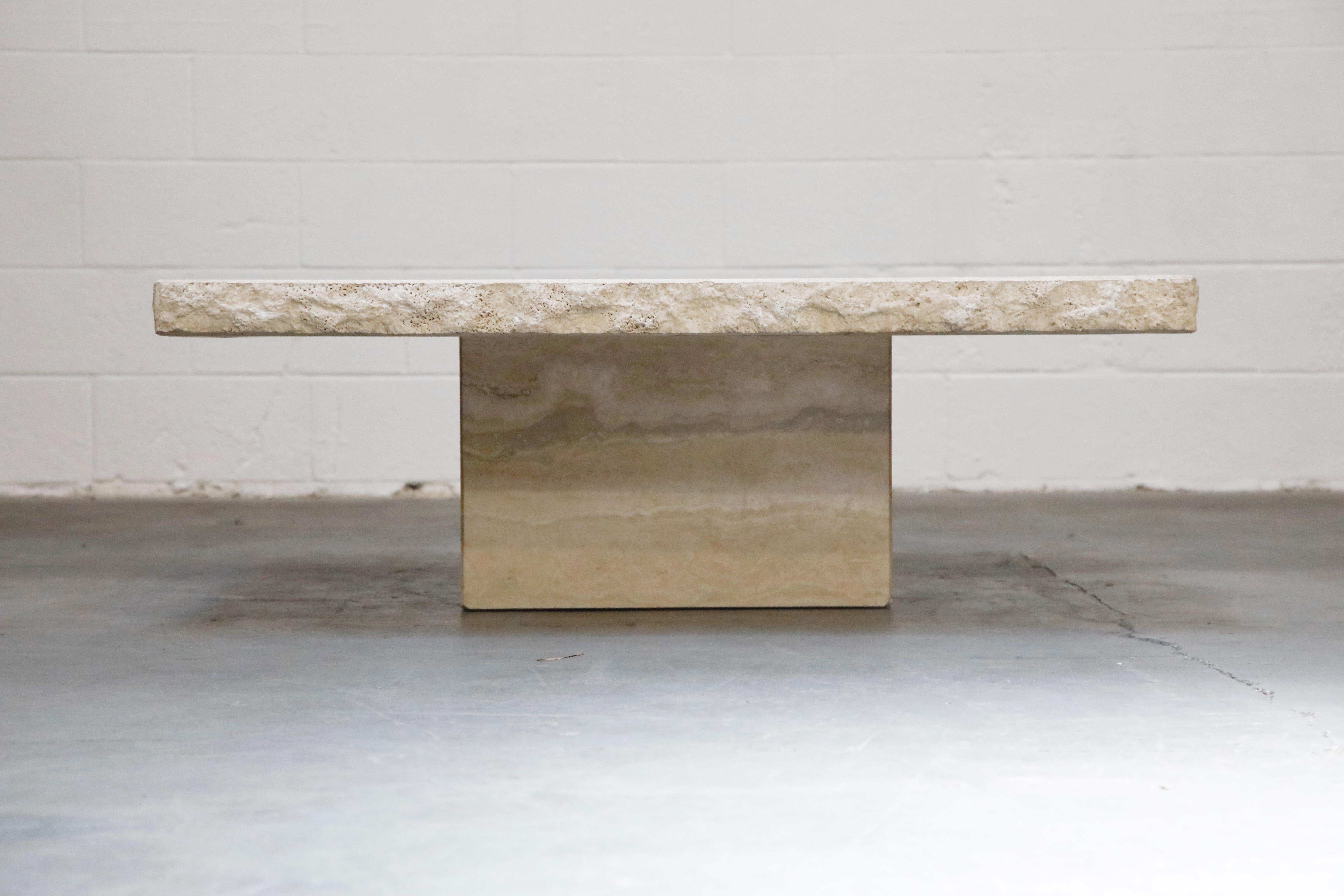 This incredibly stylish live-edge travertine coffee table is by Stone International S.p.A. in the 1970s and this table is signed with the original label underneath the travertine top. 

Travertine tables are extremely in-demand with current design