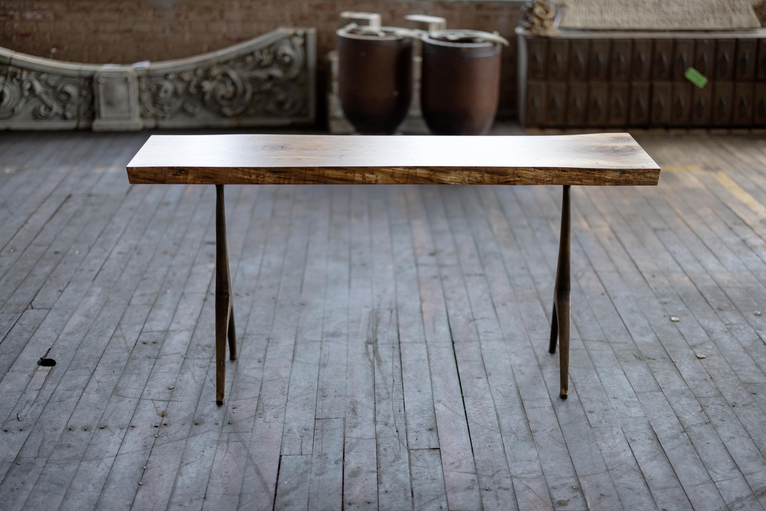 In collaboration with local metal artists and the bounty of Alabama's urban forest, this bronze pedestal console table base combines both modern and traditional production technologies. The marriage of white oak and bronze results in an irresistible