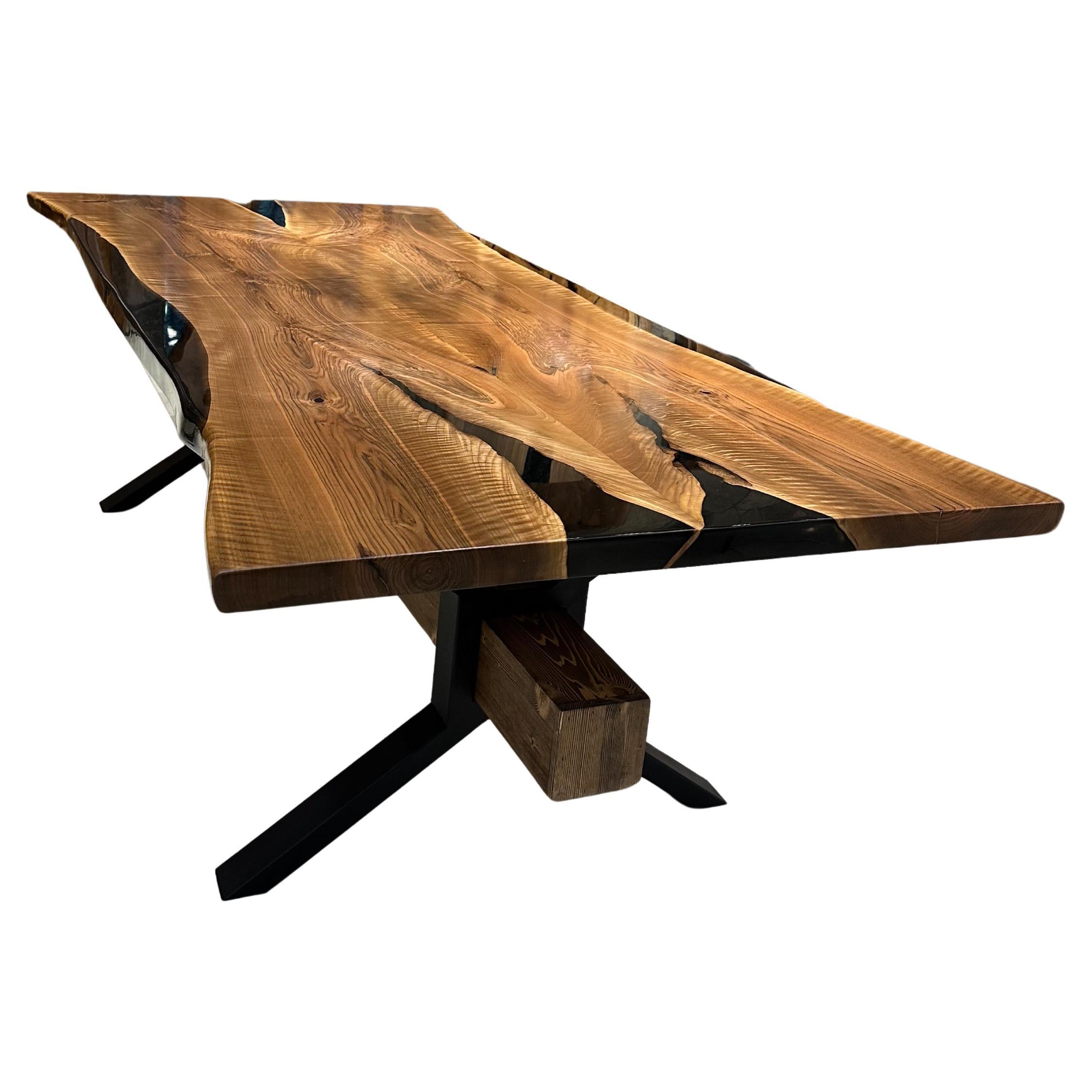 BLACK WALNUT EPOXY RESIN DINING TABLE 

This epoxy table emerges as a unique work of art, inspired by nature's beauty. 

The epoxy table stands out not only for its design but also its durability. Thanks to its epoxy coating, it is highly resistant