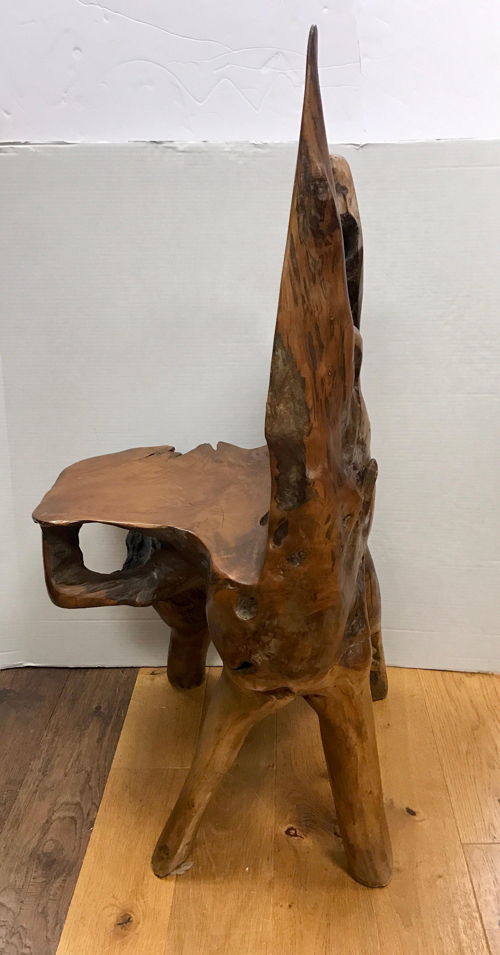 A unique accent chair using the natural shapes and contours of a bias-cut live edge slab; the result is a chair that will work for both formal and contemporary settings. Coveted, heavy live edge chair that was made to order for a client at