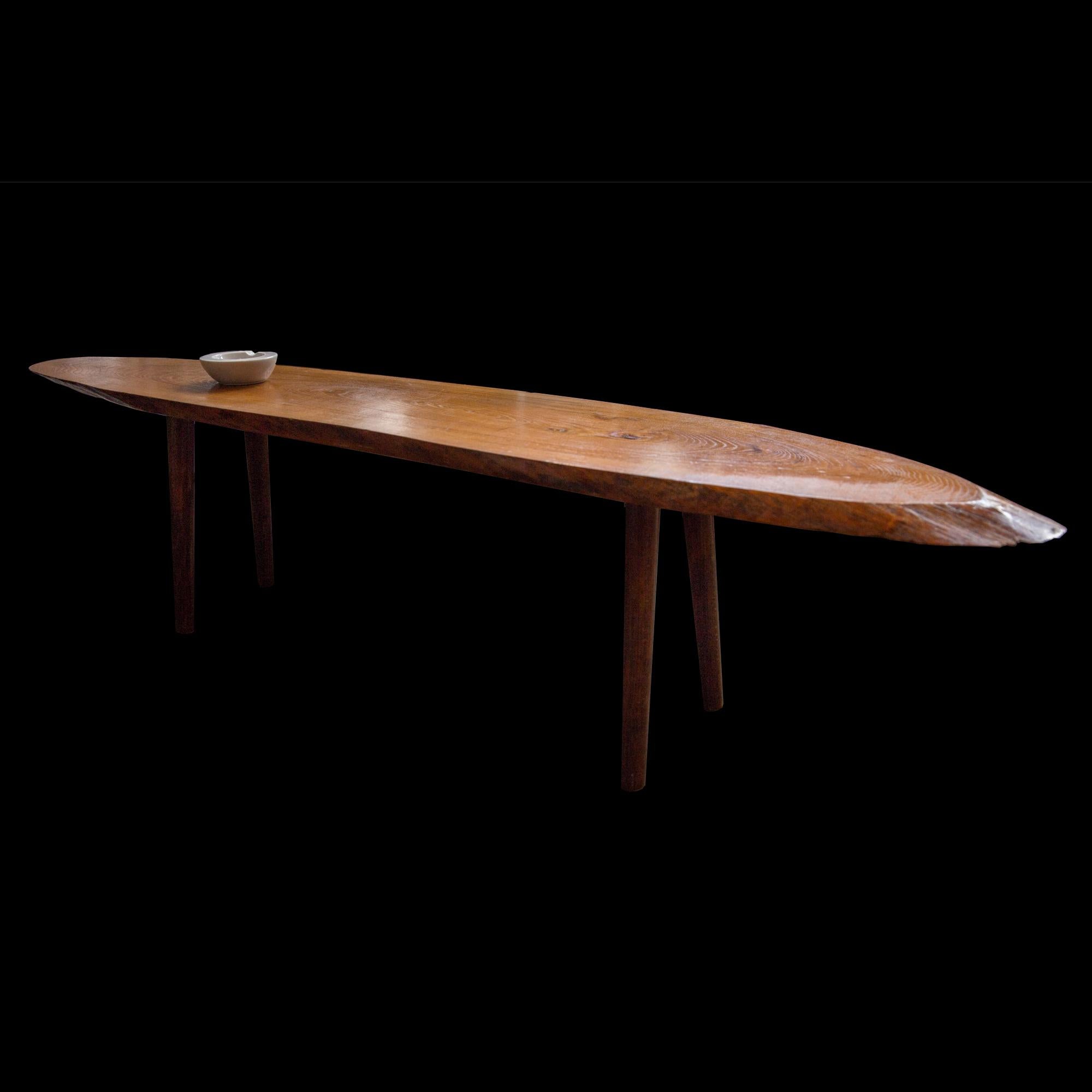 With surf board form and composition, wonderful grain. Terminating on four tapered legs.



 